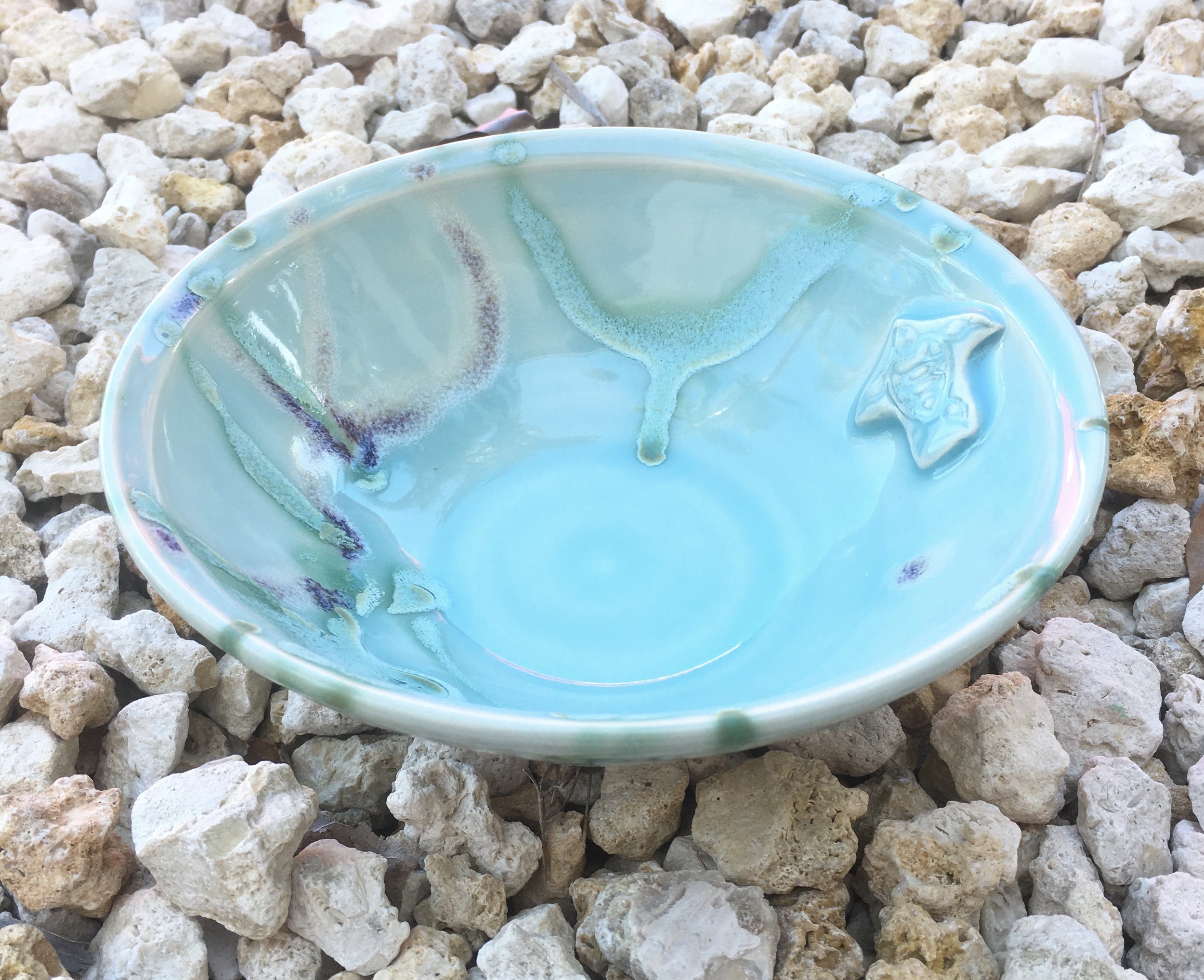7” wheel thrown bowl with turtle stamp. Blue Ice with green and black cherry streams. $40 at Artists in Paradise Gallery. Send me an email if you want to order this item.