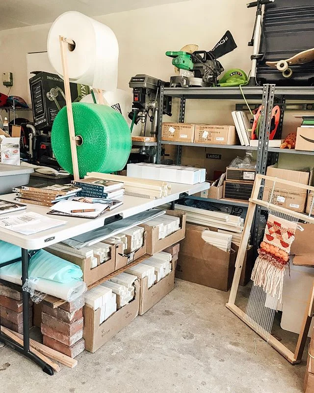 Not quite the glamorous interior design post... but I love my shipping station! It’s such a great representation of Hello Hydrangea. It’s put together with bricks and cardboard boxes in a corner of our garage... determinedly DIYed by yours truly 😂🙌🏼
I think what I love most about this setup is that it reminds me of the first time I convinced my husband that he should buy the woodworking equipment and build our first batch of adjustable looms to sell in my Etsy shop. That was about 4 years ago. He had made many looms for me already and I got questions about the unique design every time I posted a photo, so we set out with good intentions; measuring, buying supplies, learning how to use the new equipment... and then I had a HORRIBLE pregnancy aversion to the smell of wood and couldn’t even walk into the garage - leaving him to do all the work alone. 
We continued to build small batches of looms in our garage a few times a year until about a year ago when we found a supplier (who makes them look and work way better than we ever could!). We still hand package and ship them from our home, and love knowing that they are being put to good work by weavers around the US! Seeing looms take up our garage will always be a sweet reminder of how we began!
You can learn more about our unique adjustable weaving looms on my website, by going to the link in my profile and clicking on Looms.
XO
Lindsey
.
. .
.
.
.
.
#weave #interiordesign #homedecor #wallhanging #weaverfever #loom #wool #textiledesign #textiles #weavingloom #fashion #weaversofinstagram #handwoven #yarn #weaver #wallart #woven #textileart #handmade #etsy #makersmovement #love #makersgonnamake #art #weaving #fiberartist #tapestry #wovenwallhanging #design #fiberart