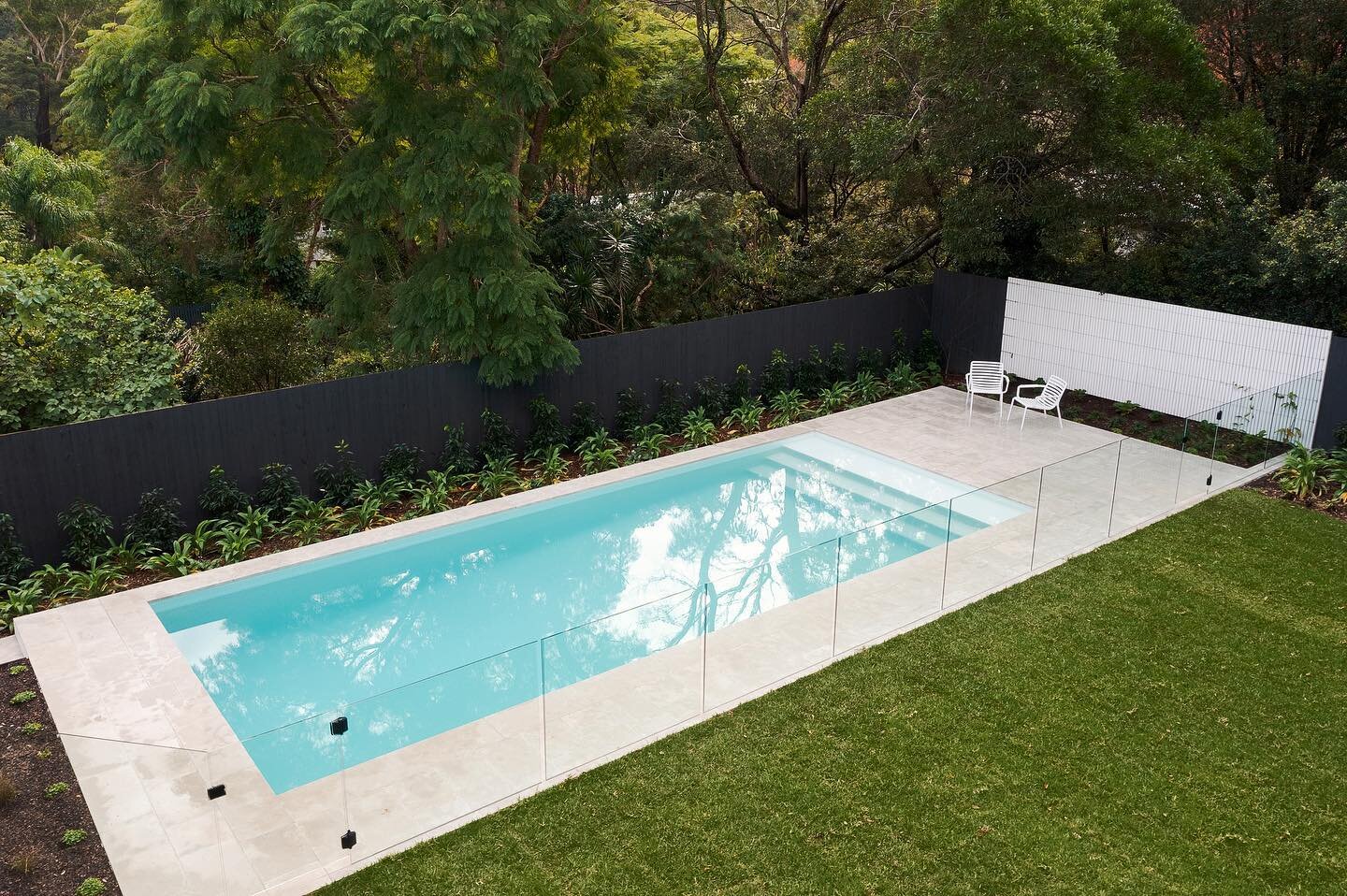 With thanks to our great friends @glazedco.sydney for the photos, our 10 x 4 project is finished in Whyte by @designerbeadcrete and installed by @tropicalpoolinteriors  Channel-fixed glass fencing by @glazedco.sydney