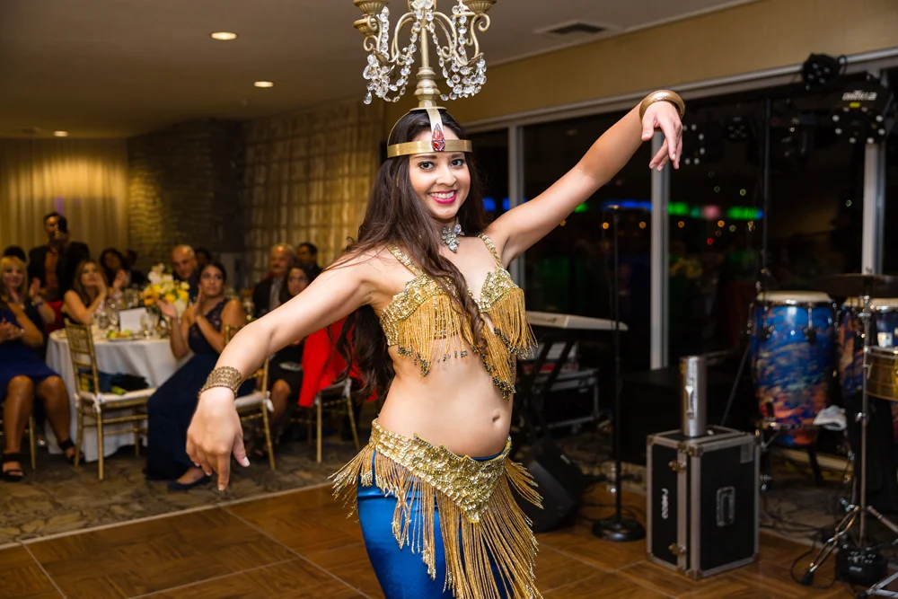 b8c3c-lively-navy-yellow-harbor-wedding-belly-dancer-dancing-with-candelabra-on-her-head.jpg