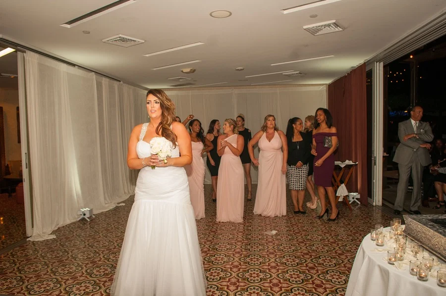 21447-beautiful-joyful-harborside-wedding-getting-ready-to-toss-bouquet.jpg