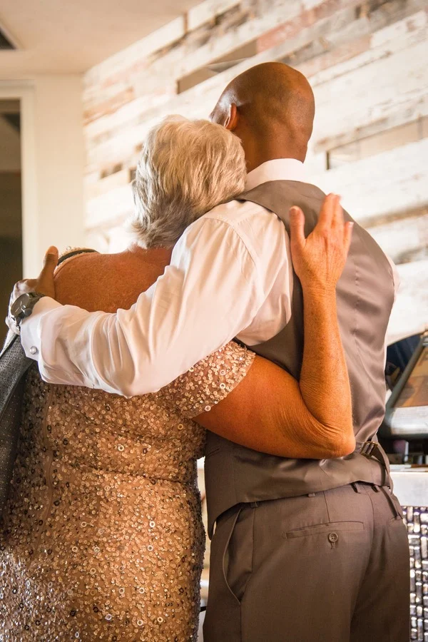 7193a-beautiful-joyful-harborside-wedding-groom-and-mother-in-law-sweet-hug.jpg