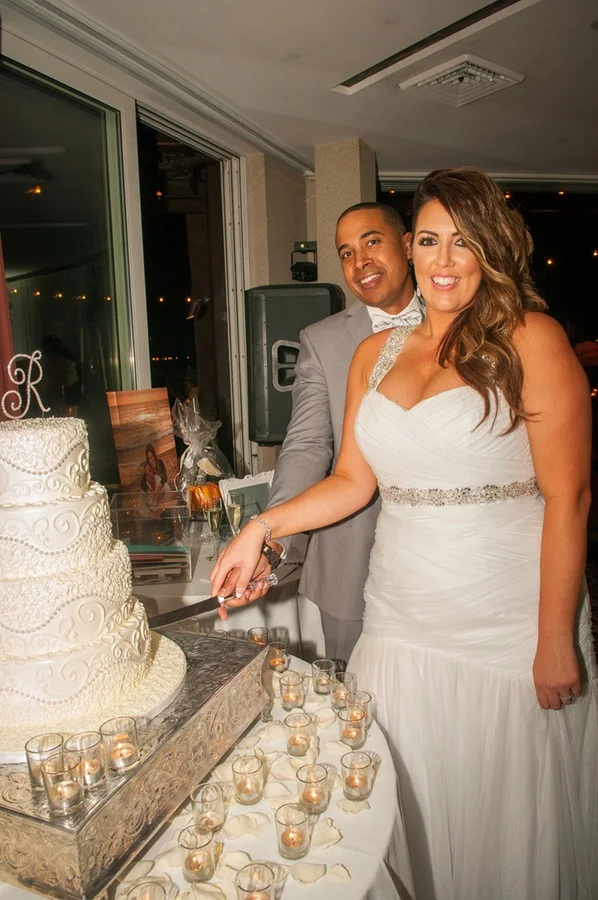 d9ab0-beautiful-joyful-harborside-wedding-cutting-of-the-cake.jpg