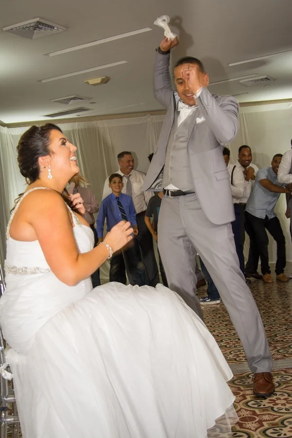f995d-beautiful-joyful-harborside-wedding-groom-throwing-garter.jpg