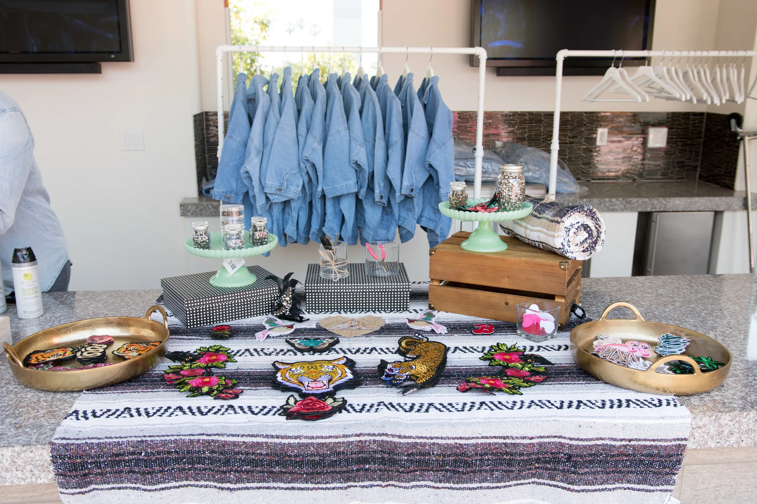 Peek Inside Celebrity Pre-Coachella Gifting Suite custom denim jacket station with patches and bling.jpg