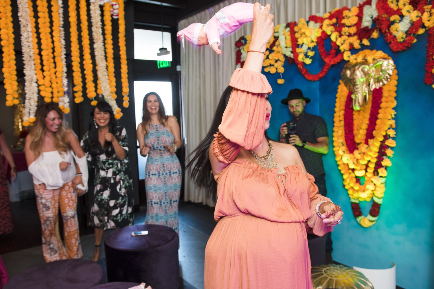 Moroccan Inspired Baby Shower Party loriann tossing the baby.jpg