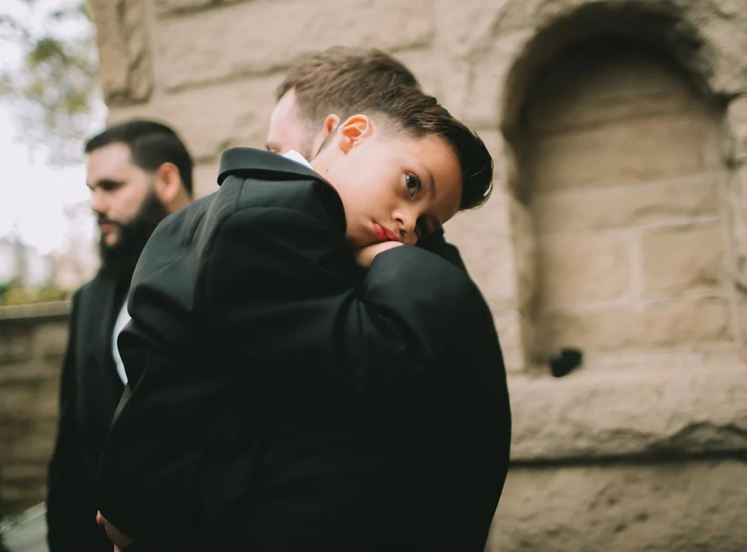 Breathtaking Contemporary Jewel Toned Fall Posh Wedding son hugs his dad.jpg