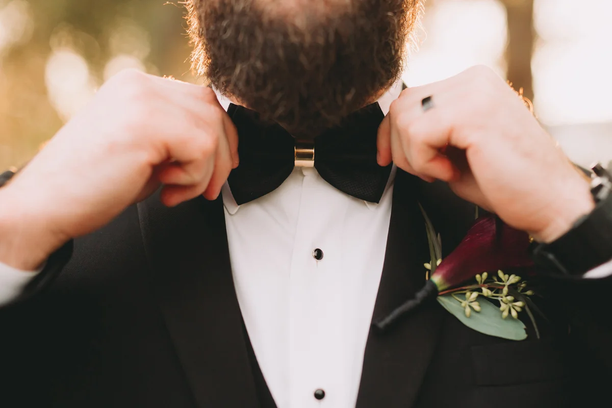 Breathtaking Contemporary Jewel Toned Fall Posh Wedding groom in bow tie.jpg