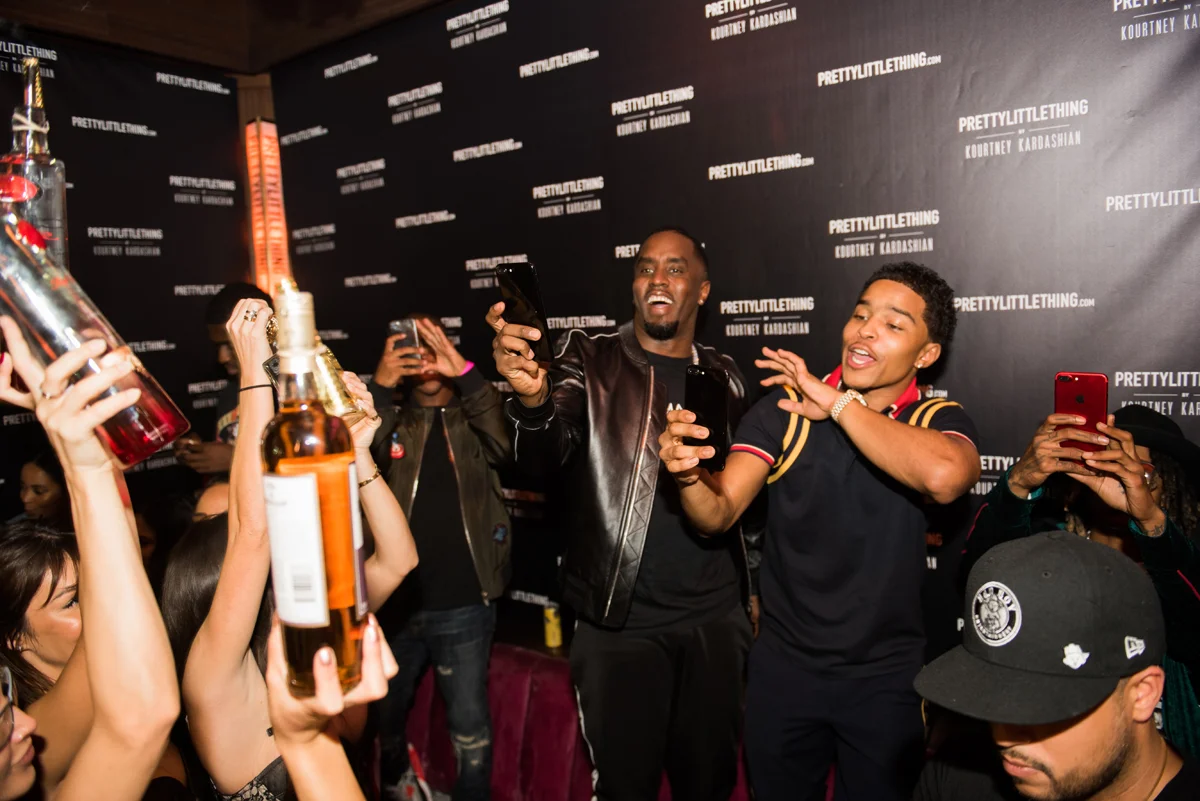 PrettyLittleThing PLT X Kourtney Kardashian Collection Celebrity Launch Party P Diddy having fun at the party.jpg