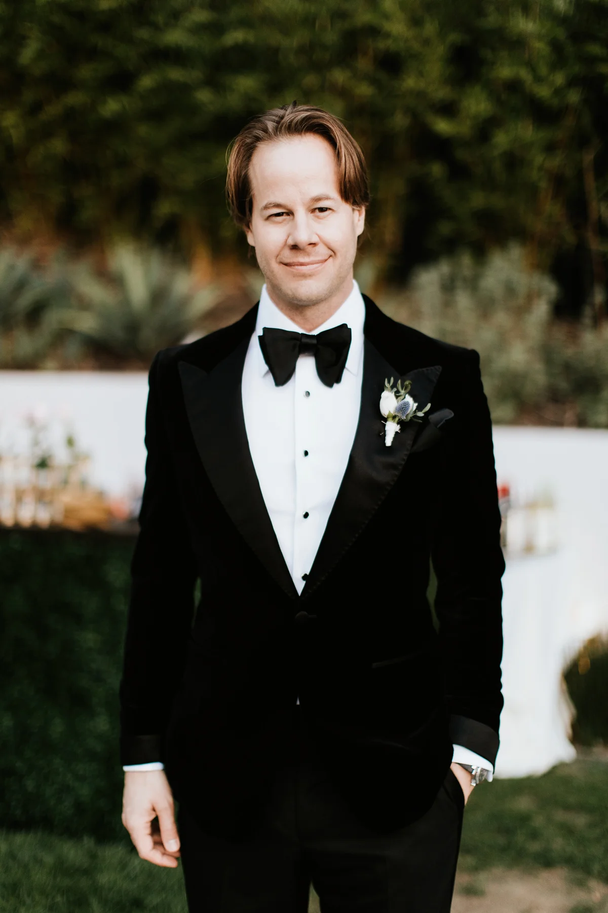 Dreamy Starry Nights Wedding groom standing in tux by the pool.jpg