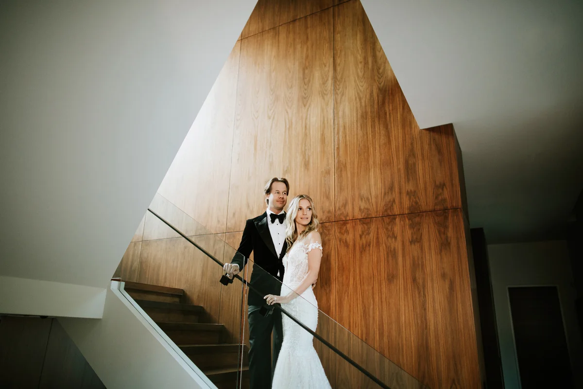 Dreamy Starry Nights Wedding bride and groom pose on the grand stairs.jpg