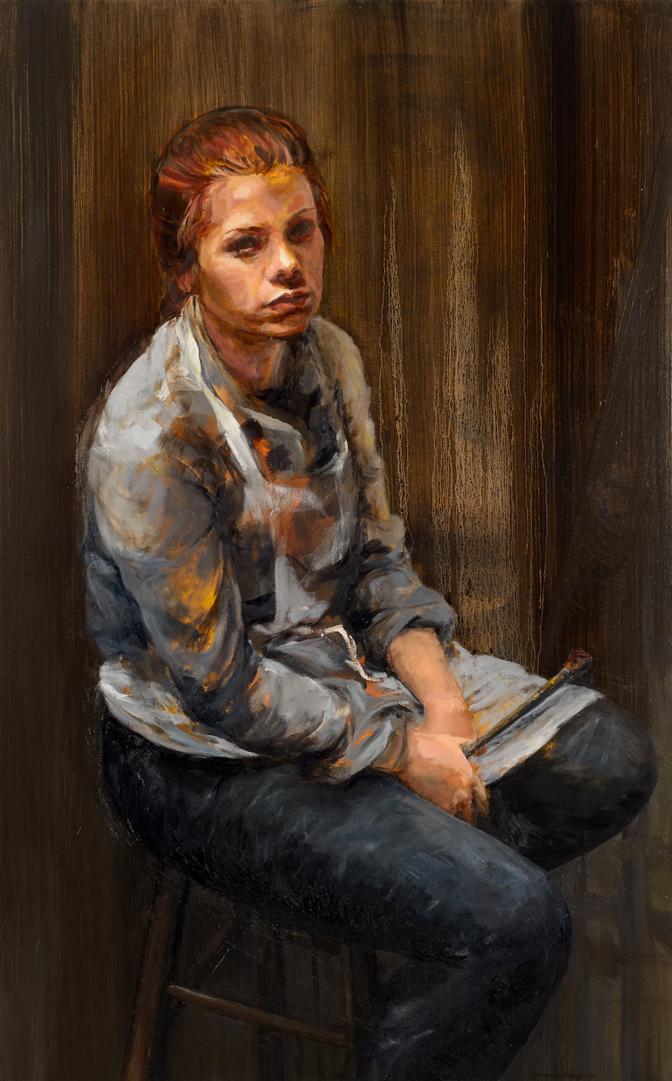 Hannah sitting with paintbrush.png
