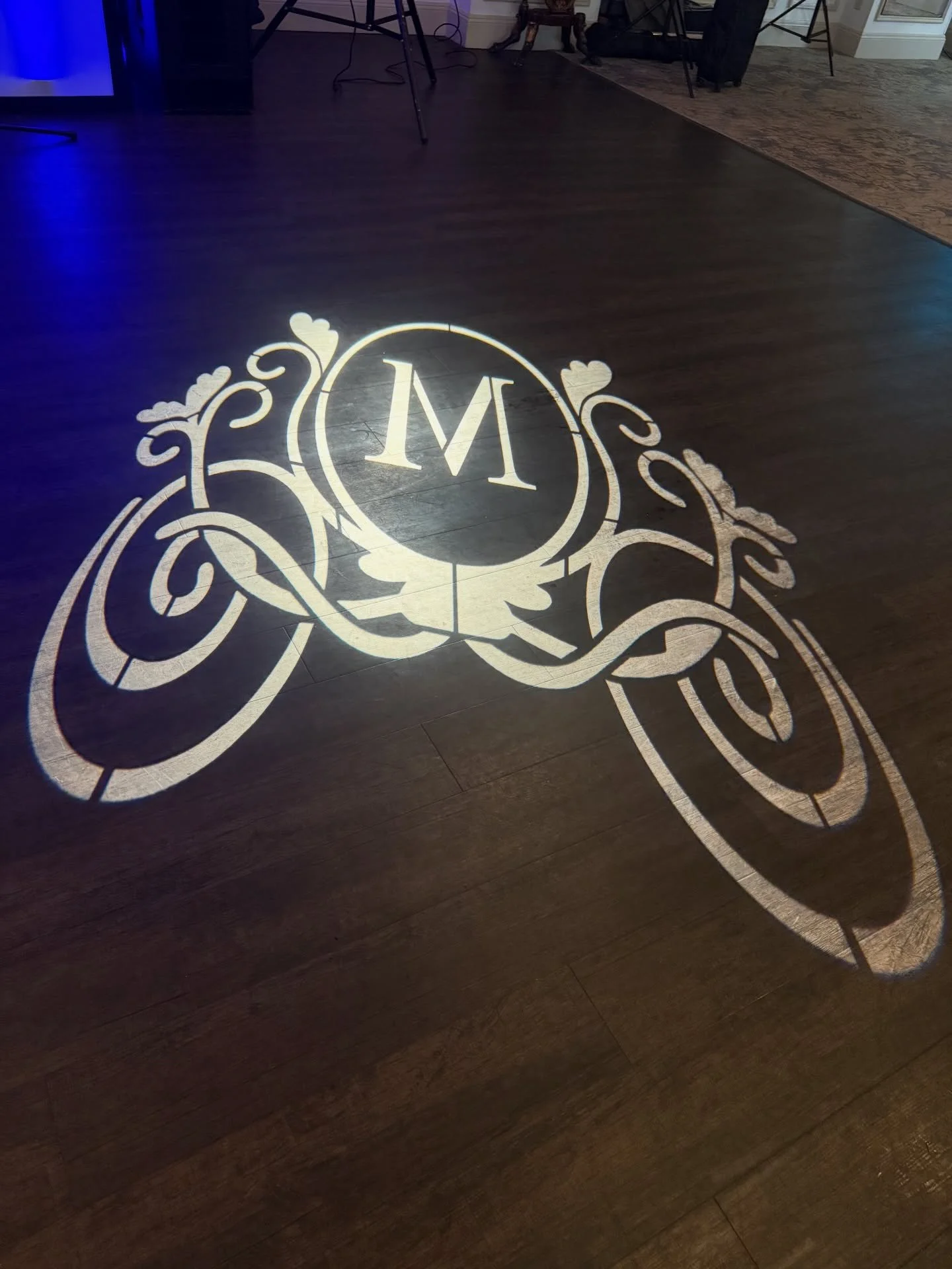 Madison &amp; Matthew&rsquo;s custom monogram lighting on the dance floor ✨ A perfect personalized touch for their wedding night.  #monogram #gobo #customgobo #sgproductionsdjs
