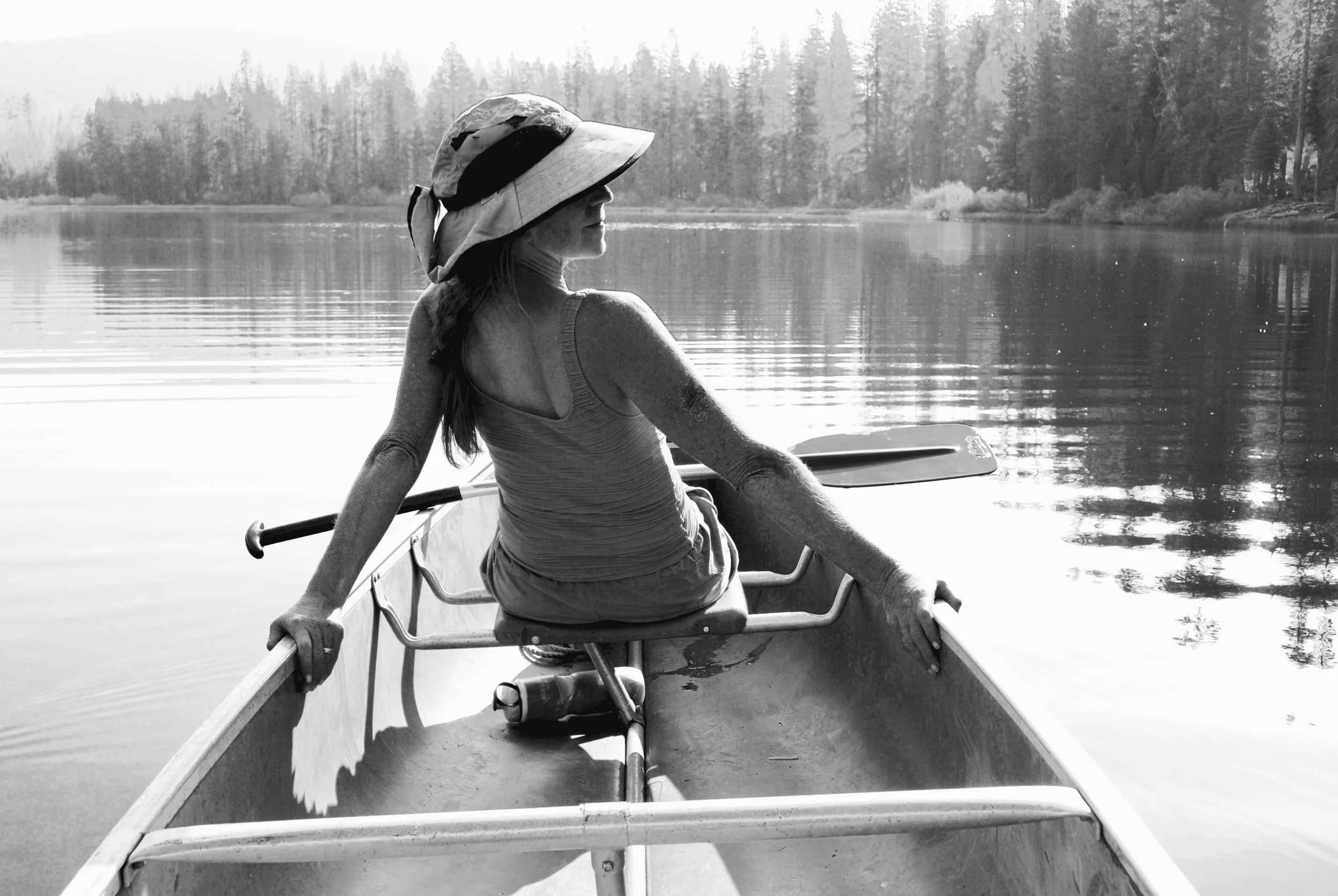 My sister Susan in the front of our canoe.