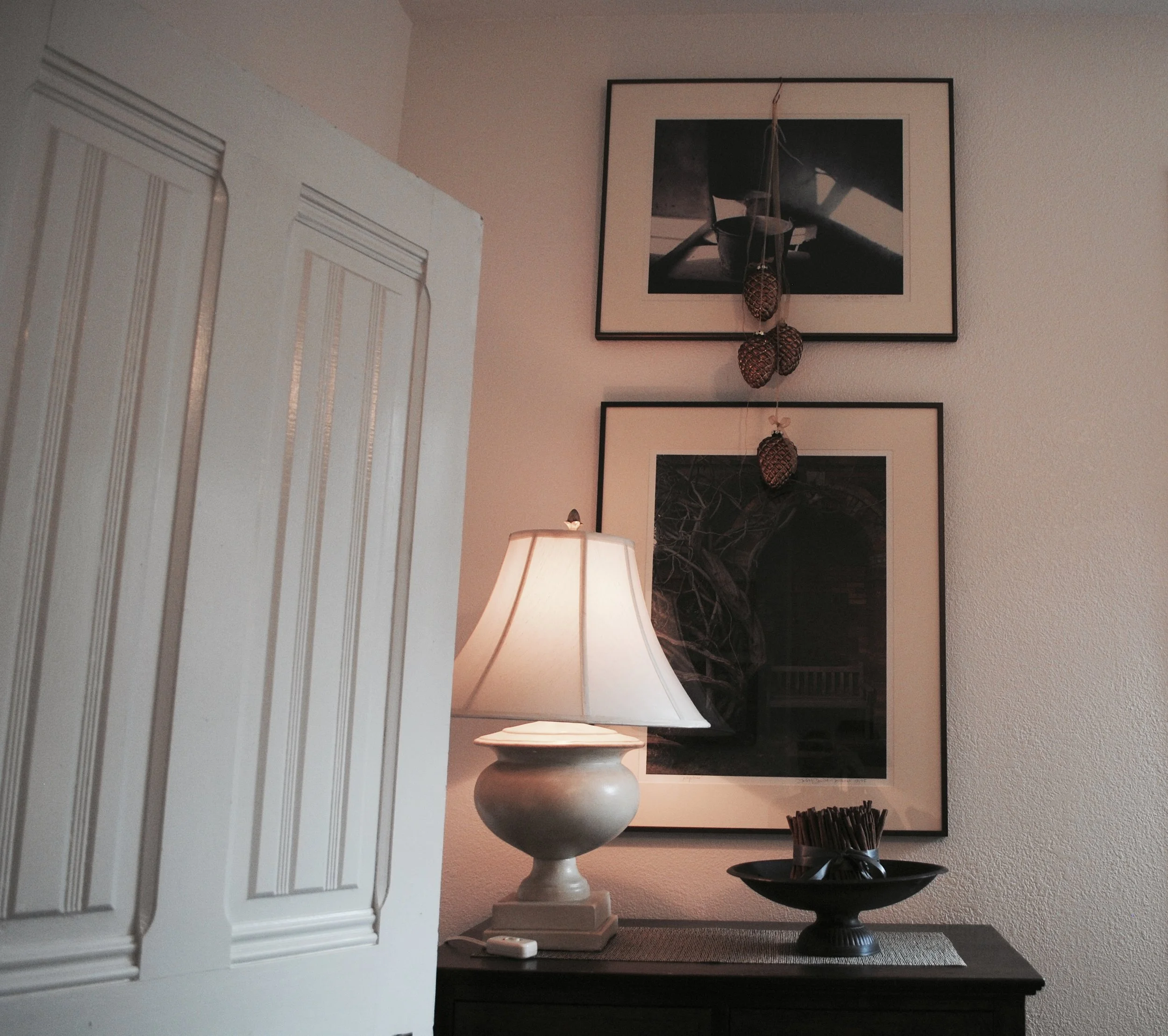 Two favorite photographs by Northwest artist Deborah DeWit hang above the chest of drawers in the main sitting room, 