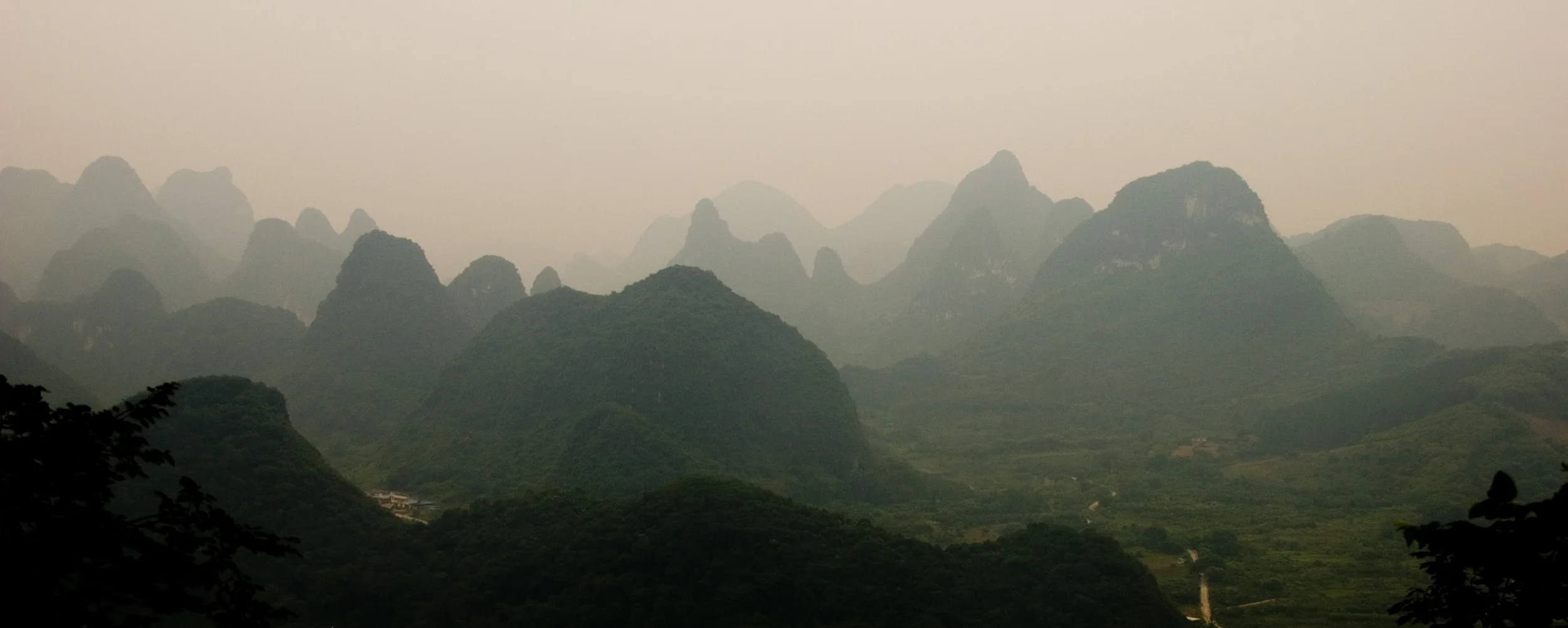 A view of the top of Moon Hill in Guangxi Region (just a few kilometres outside of Yangzhuo). The landscape of the region figured heavily in Chinese Art throughout history. It's primarily made up of these relatively small, limestone karts. It's a truly unique corner of the world! The first of this series has been moved from the gallery to the Wind Gallery.