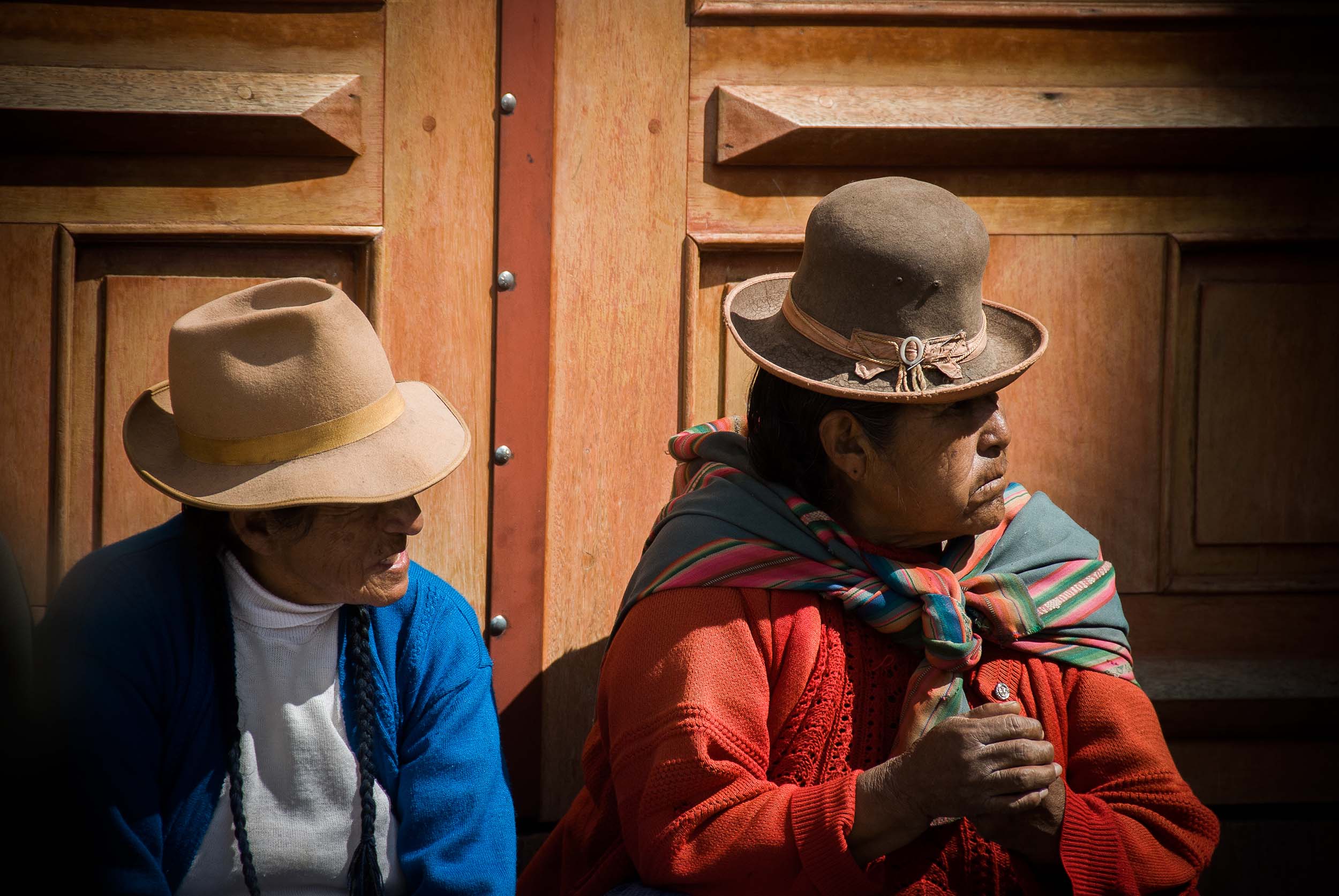 Two locals people-watching in Cusco