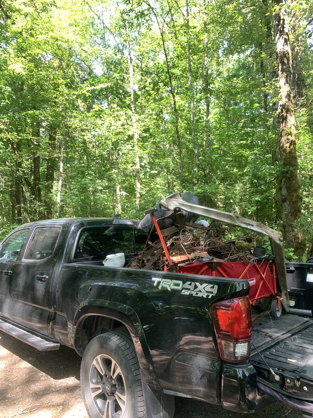 June 1 - truck full of things pulled out of estuary with students.jpg