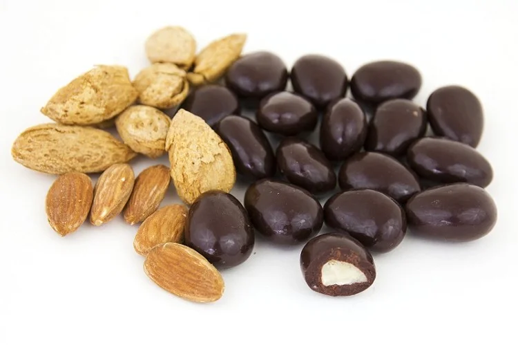 almonds on left with chocolate covered marzipan on right