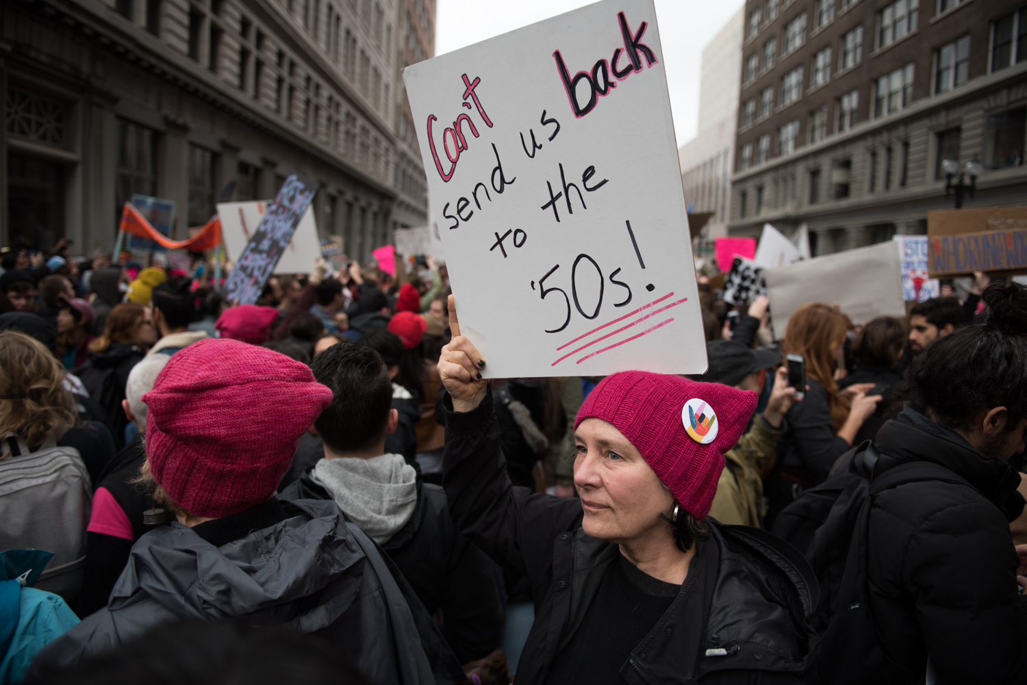 Noreen Axelson holds a sign during the Women's March in Oakland on Saturday, January 21, 2017. | Rosa Furneaux for the East Bay Express