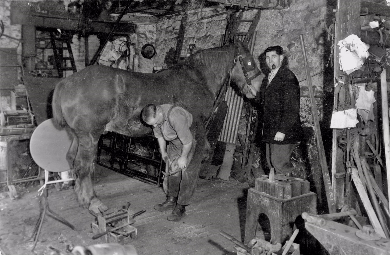 Weetwood Lane Forge with blacksmith W.A. Hartley, circa 1956