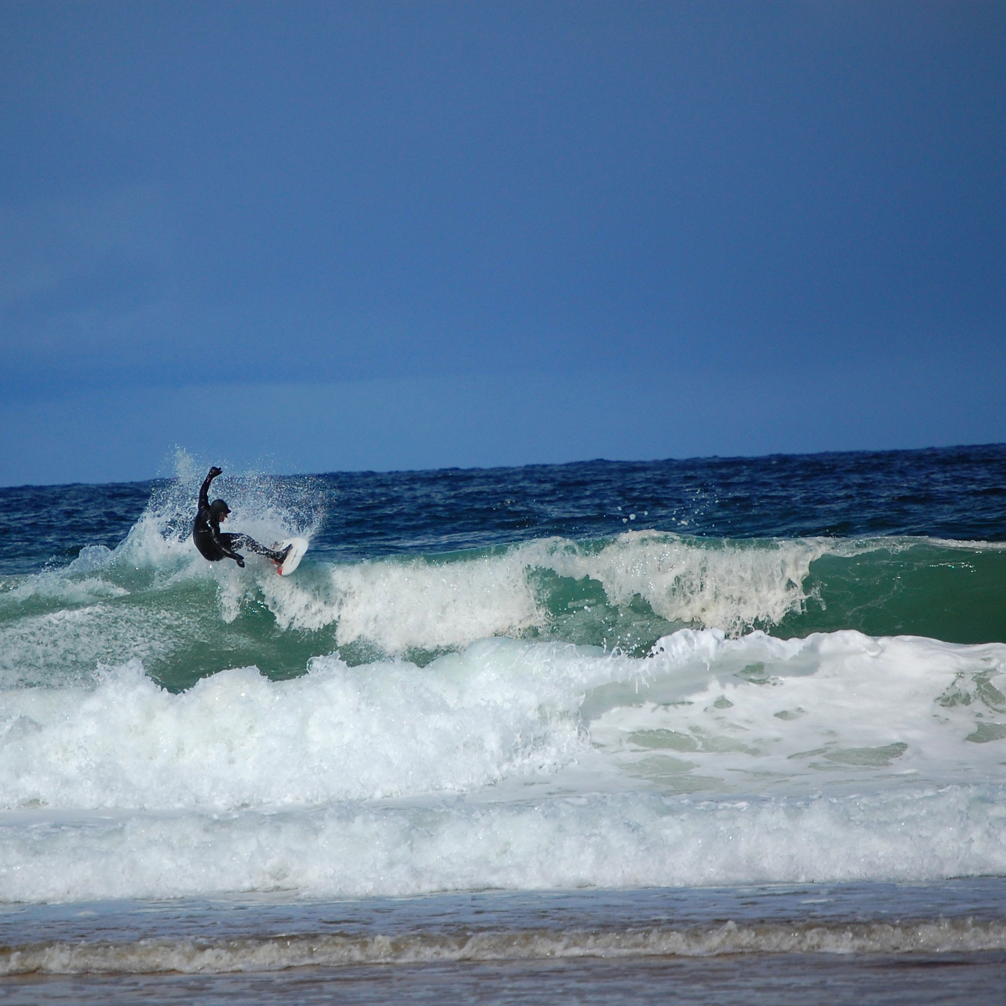 A surfer in big waves