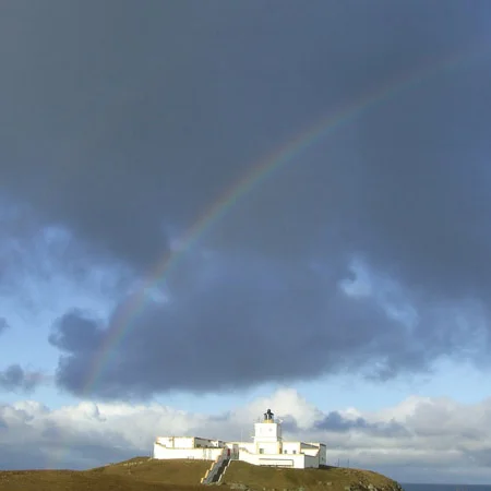 Strathy lighthouse and a rainbow