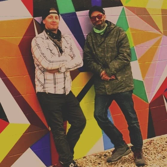 Trained, tested and certified graphic installers pose next to a textured wall wrap in Milwaukee, Wisconsin.