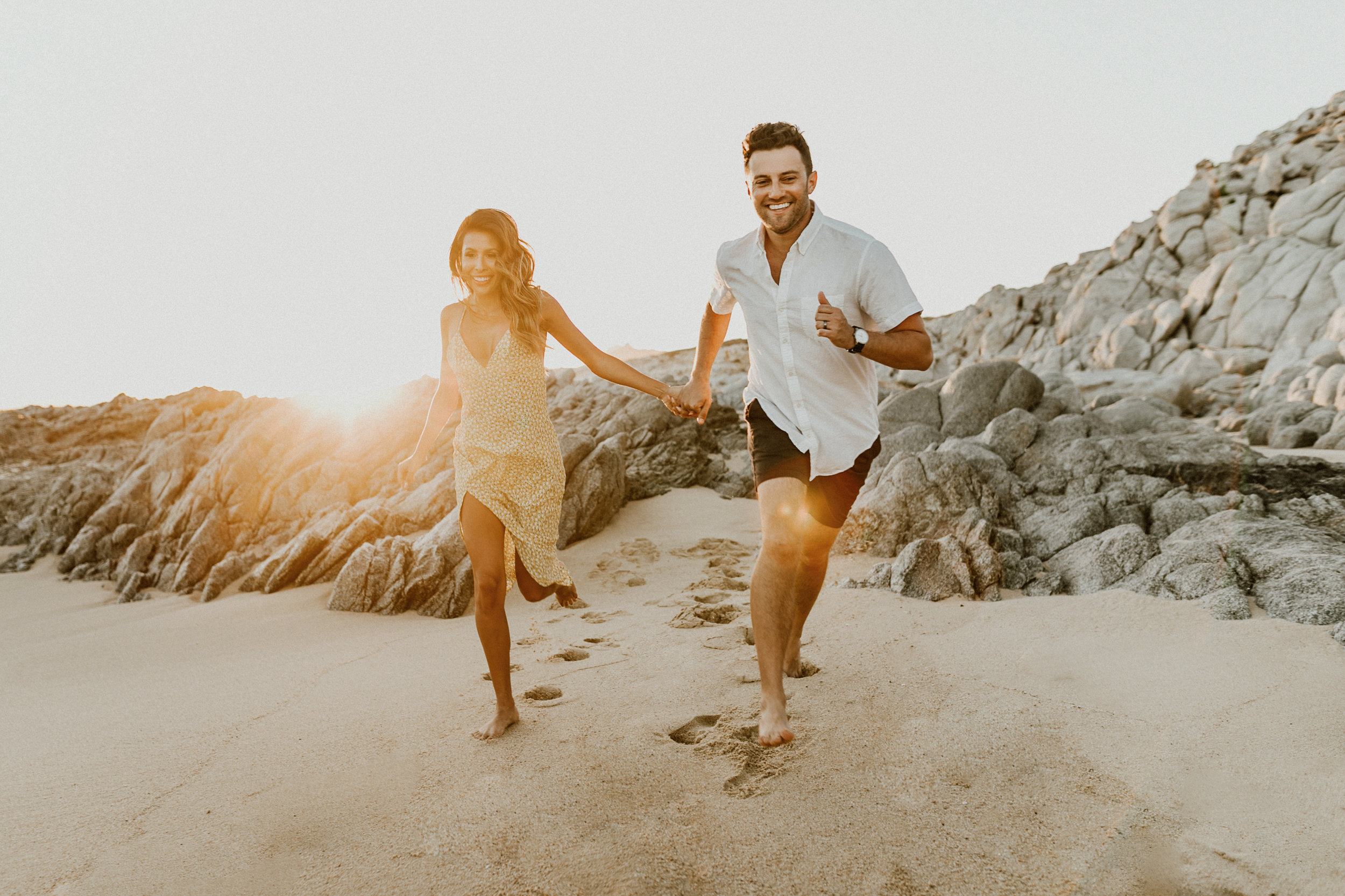 couple at the beach for honeymoon photo