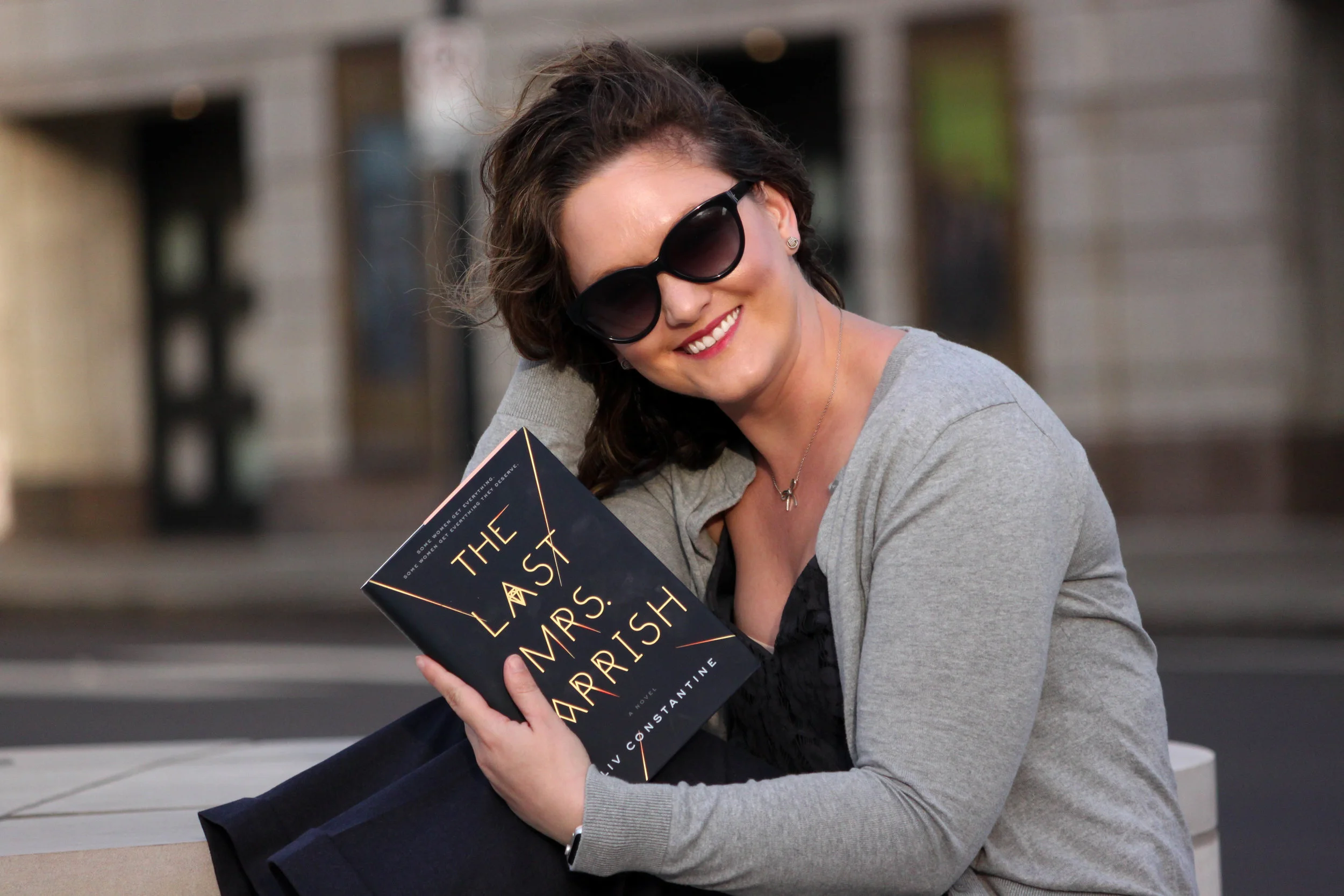 Reading The Last Mrs. Parrish by Liv Constantine outside the Fox Theatre in St. Louis, MO