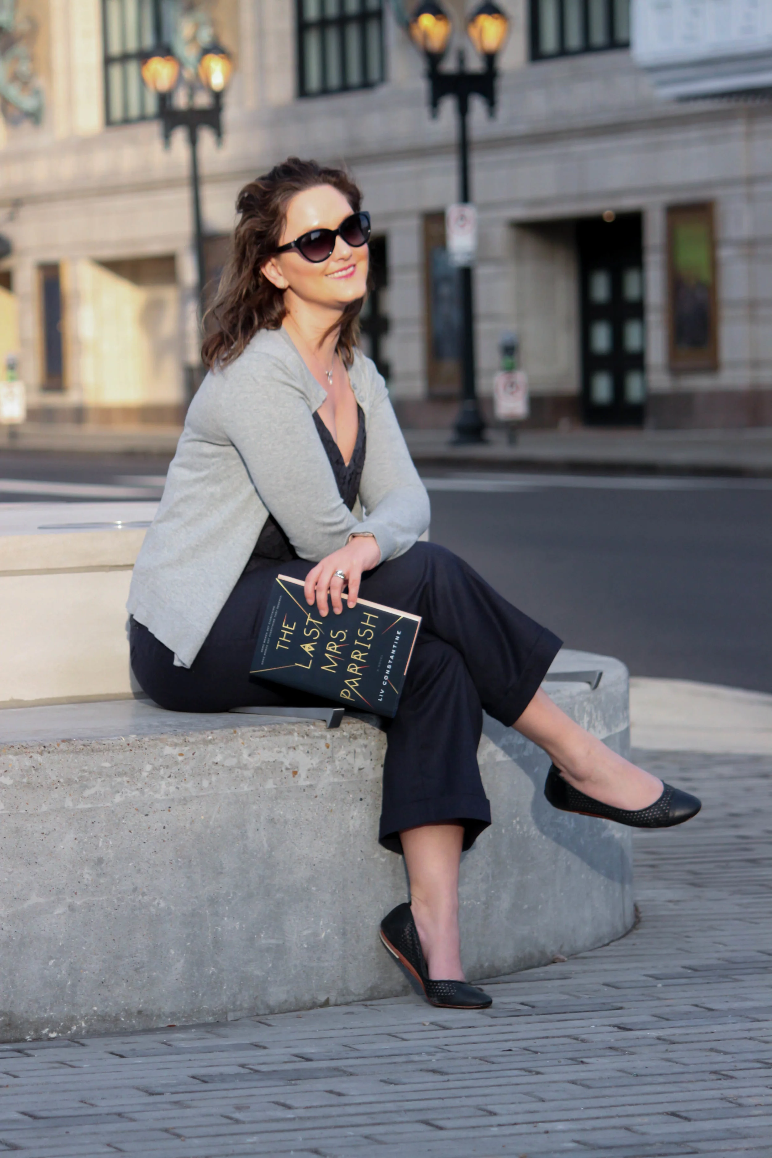 Reading The Last Mrs. Parrish by Liv Constantine outside the Fox Theatre in St. Louis, MO