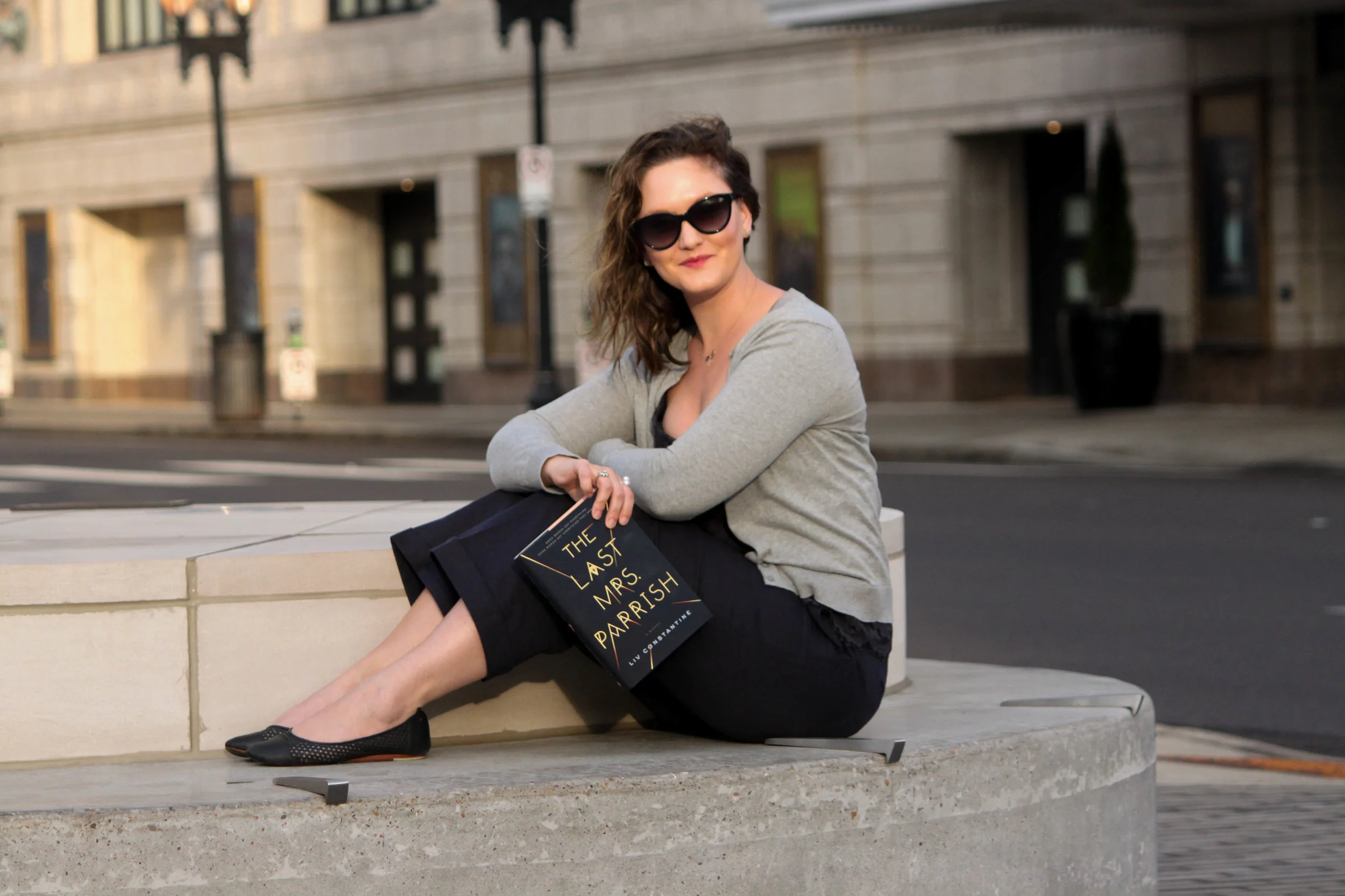 Reading The Last Mrs. Parrish by Liv Constantine outside the Fox Theatre in St. Louis, MO