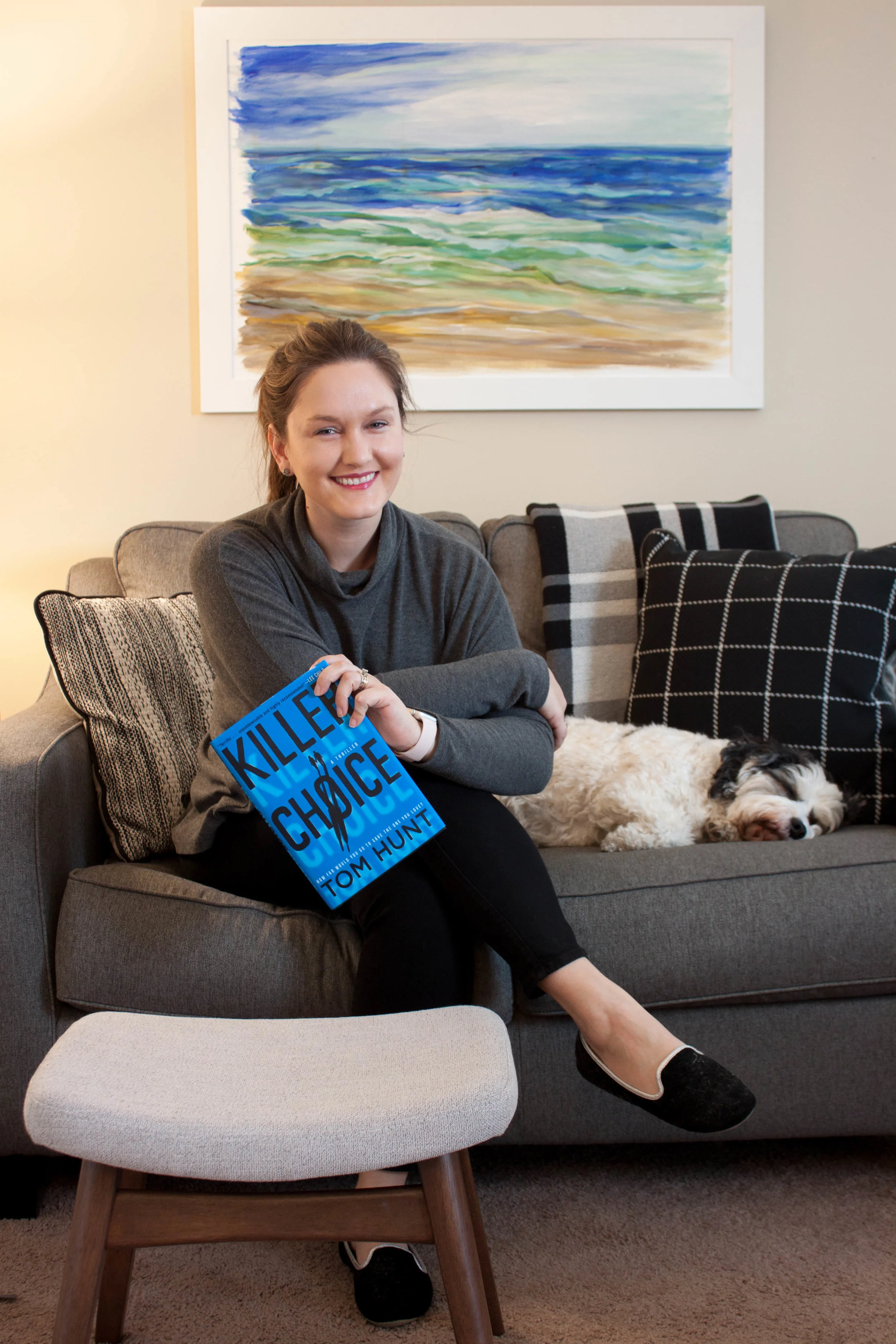 Reading Killer Choice by Tom Hunt at home with my dog, Huxley