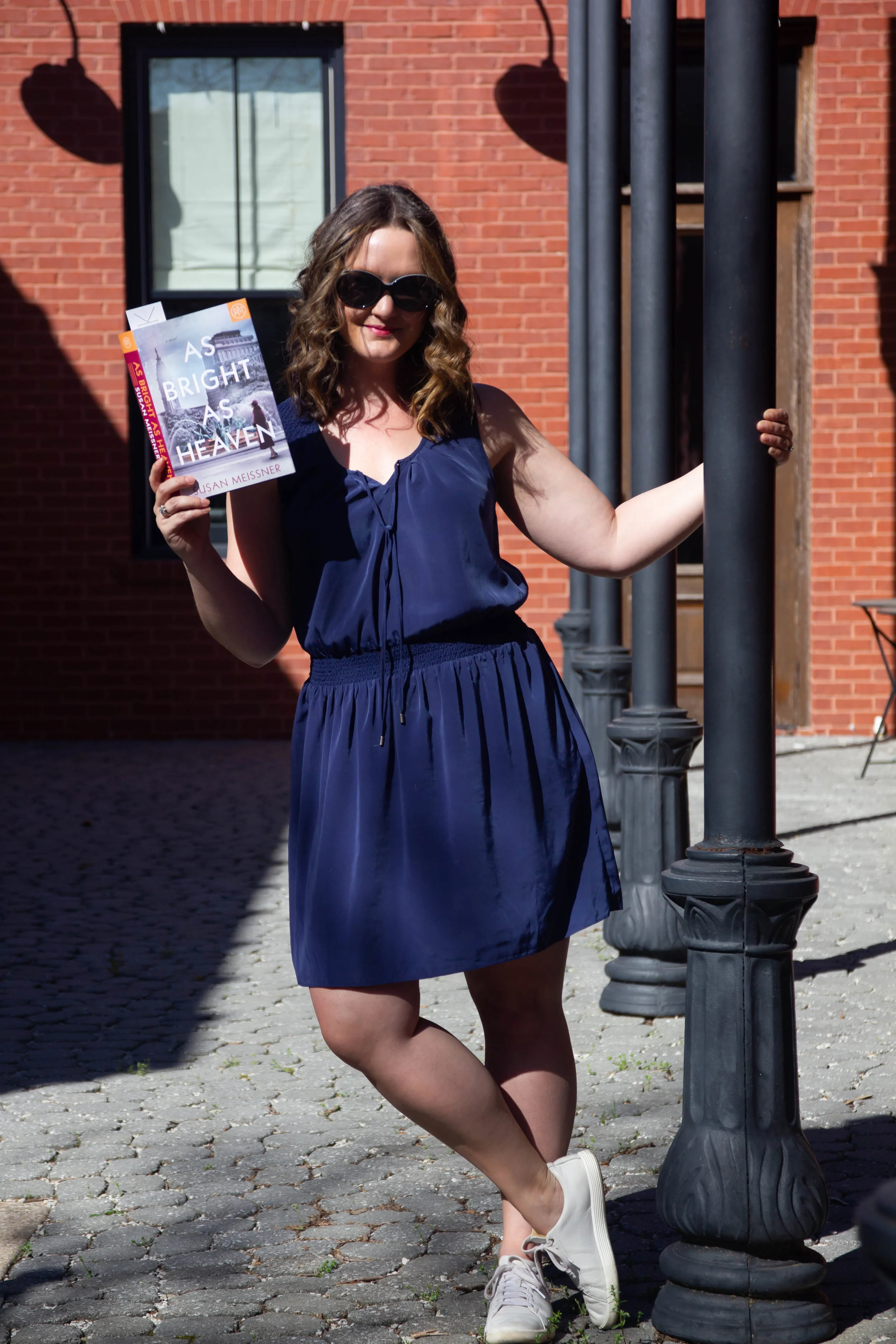 Reading As Bright As Heaven by Susan Meissner in New Town at St. Charles, MO (but it could be a cafe in France, no?)