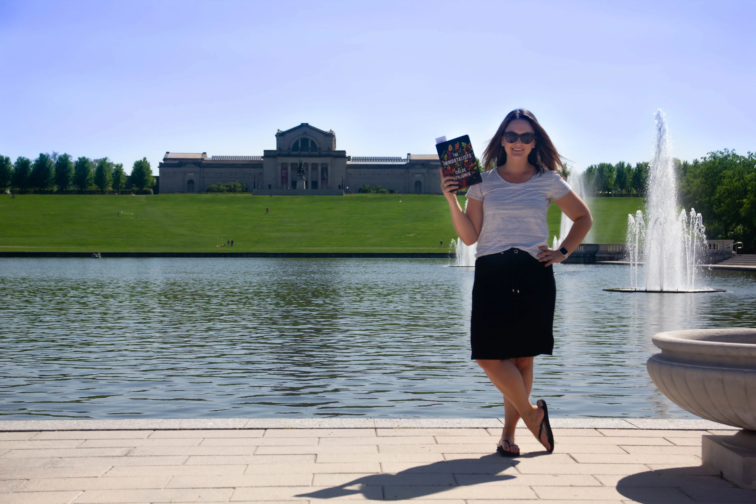 Reading The Immortalists by Chloe Benjamin at the Grand Basin outside the St. Louis Art Museum