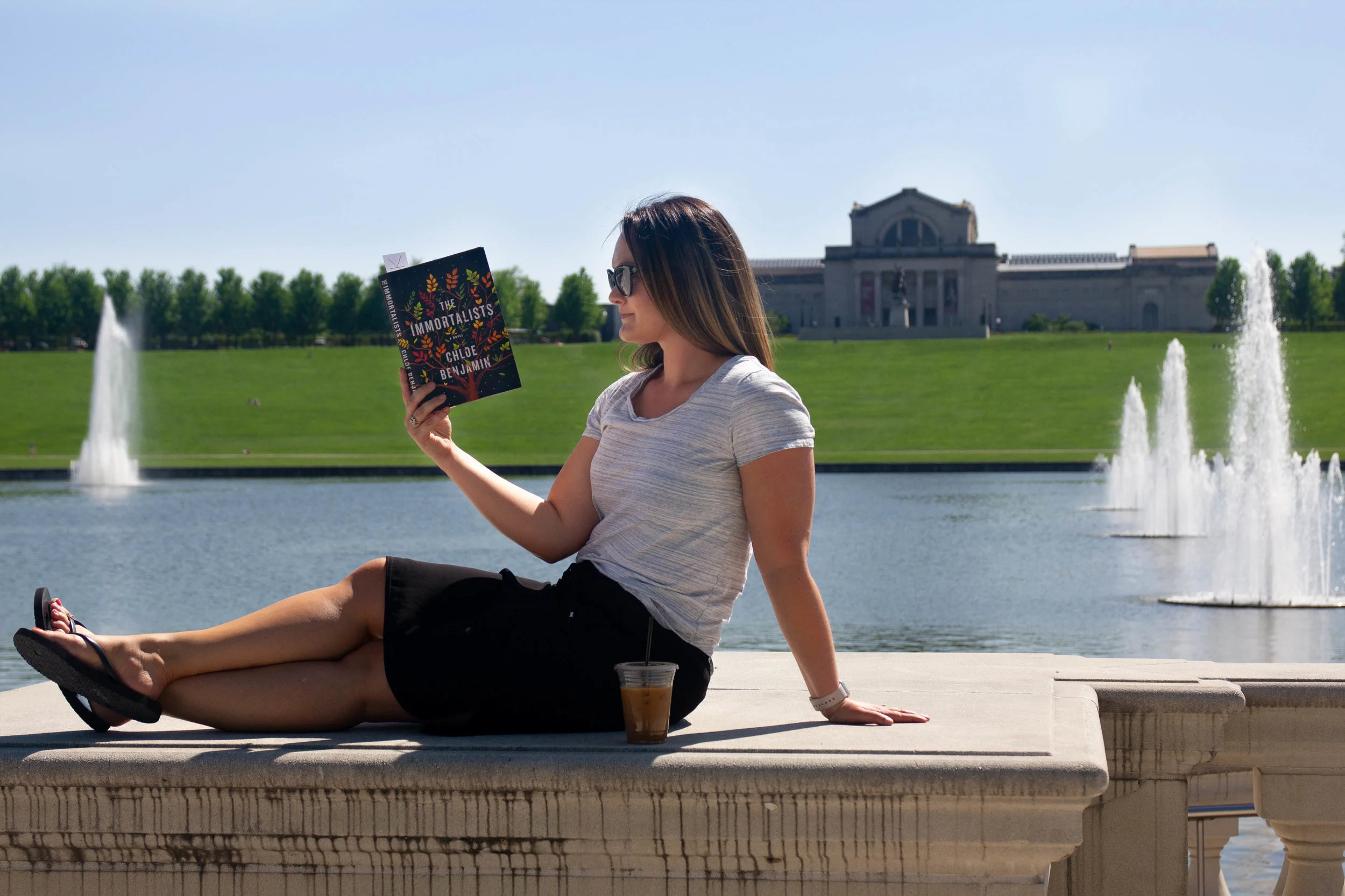 Reading The Immortalists by Chloe Benjamin at the Grand Basin outside the St. Louis Art Museum