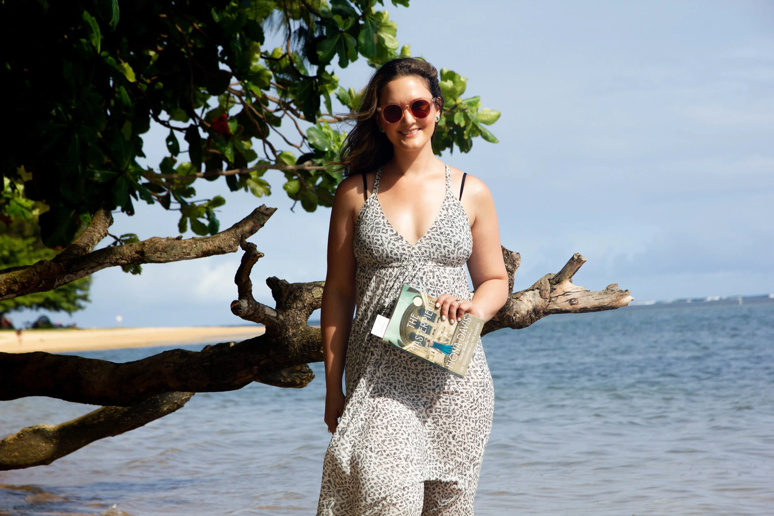 Reading The Masterpiece on Anini Beach in Kauai, Hawaii