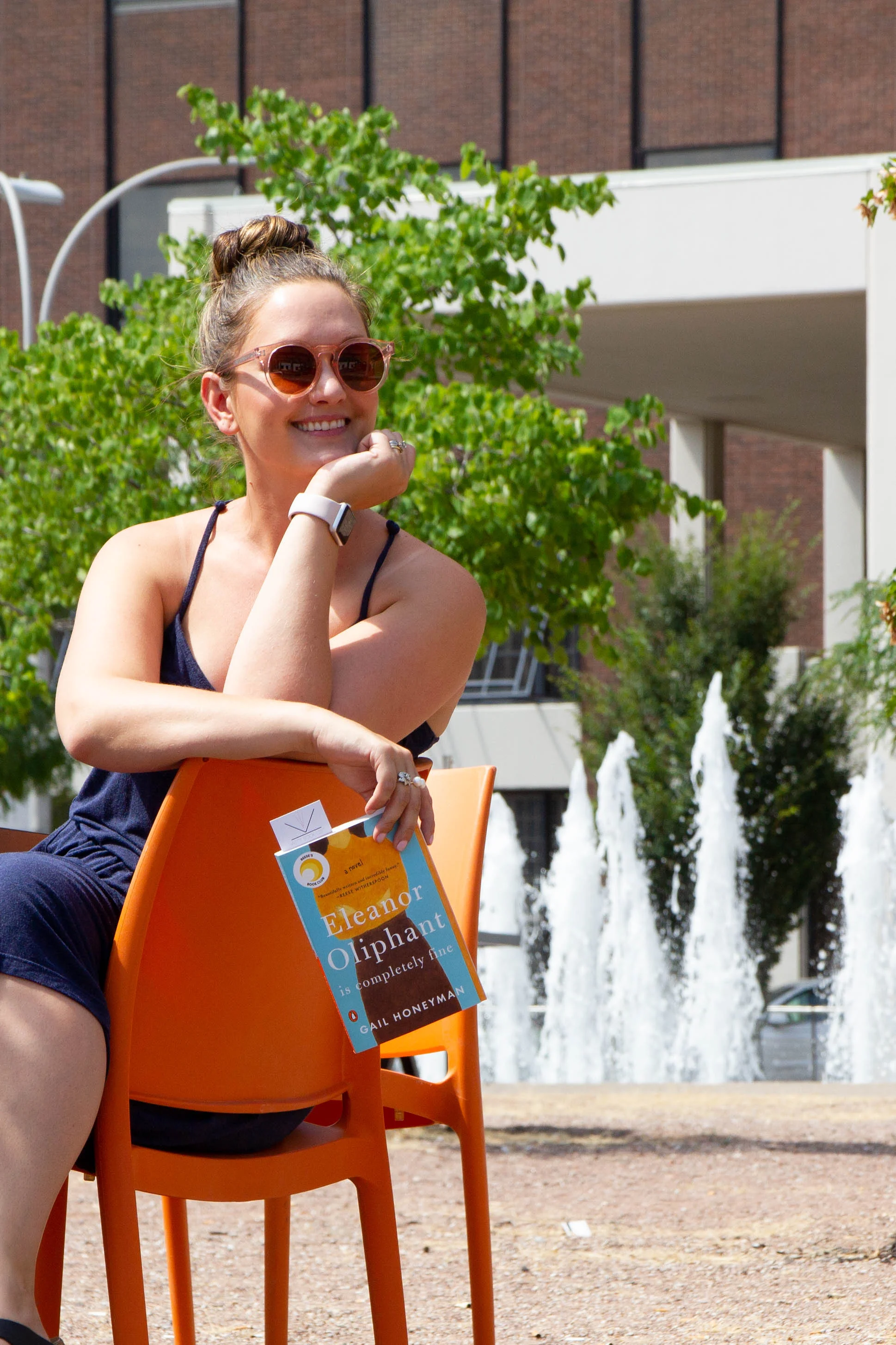 Reading Eleanor Oliphant is Completely Fine in Barney Allis Plaza in Kansas City, MO