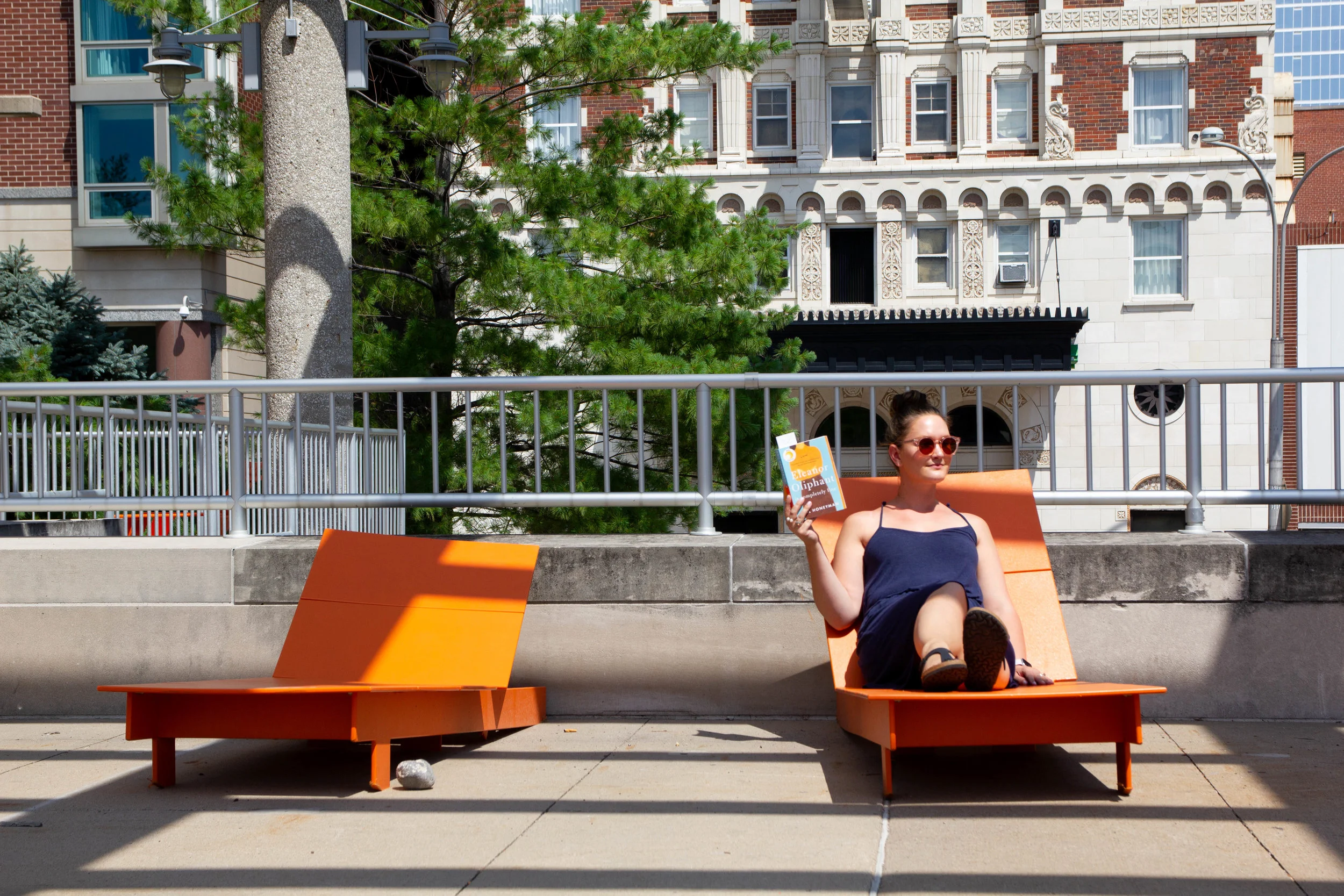 Reading Eleanor Oliphant is Completely Fine in Barney Allis Plaza in Kansas City, MO
