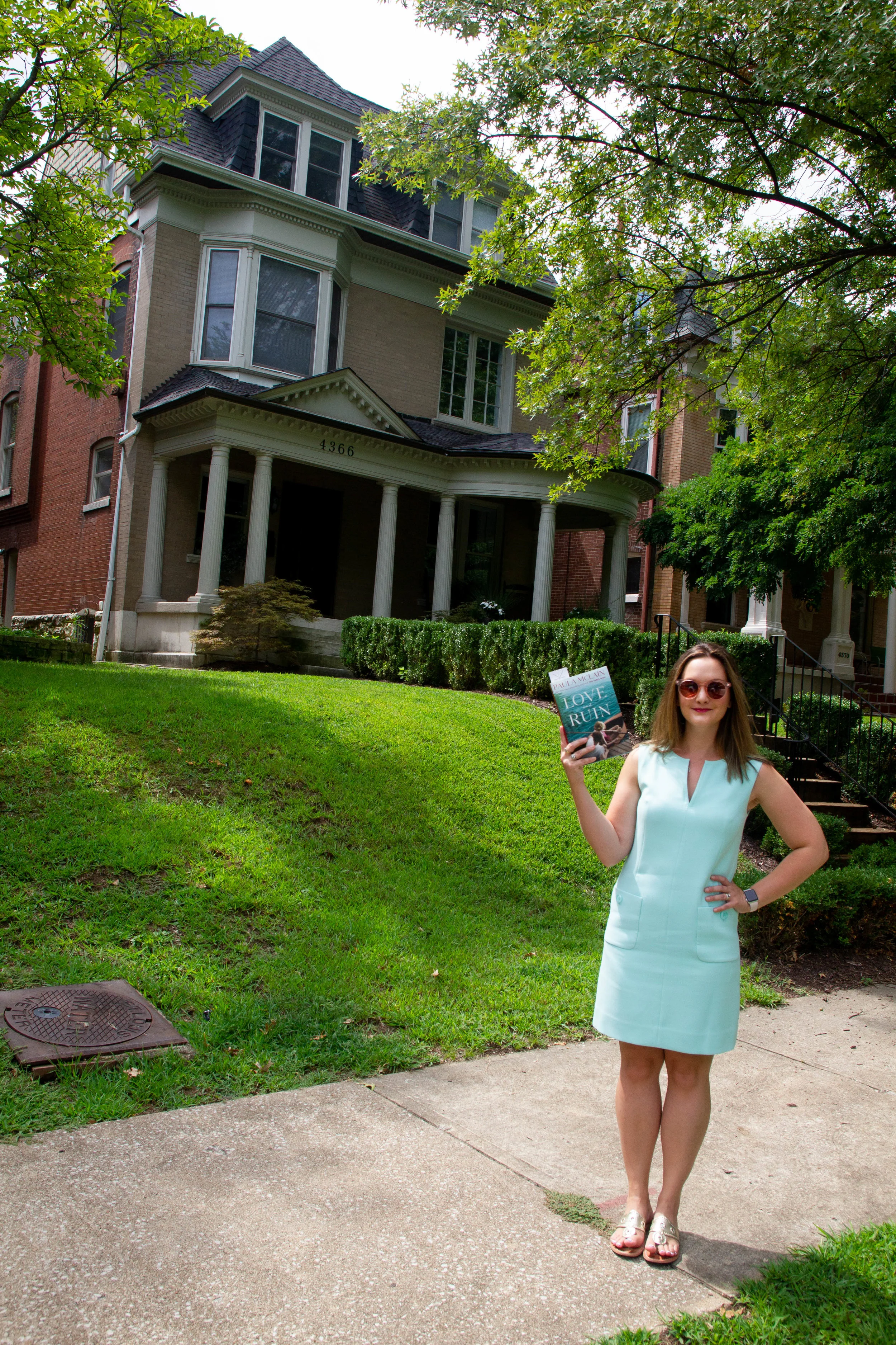 Reading Love and Ruin by Paula McLain outside Martha Gellhorn's childhood home in St. Louis