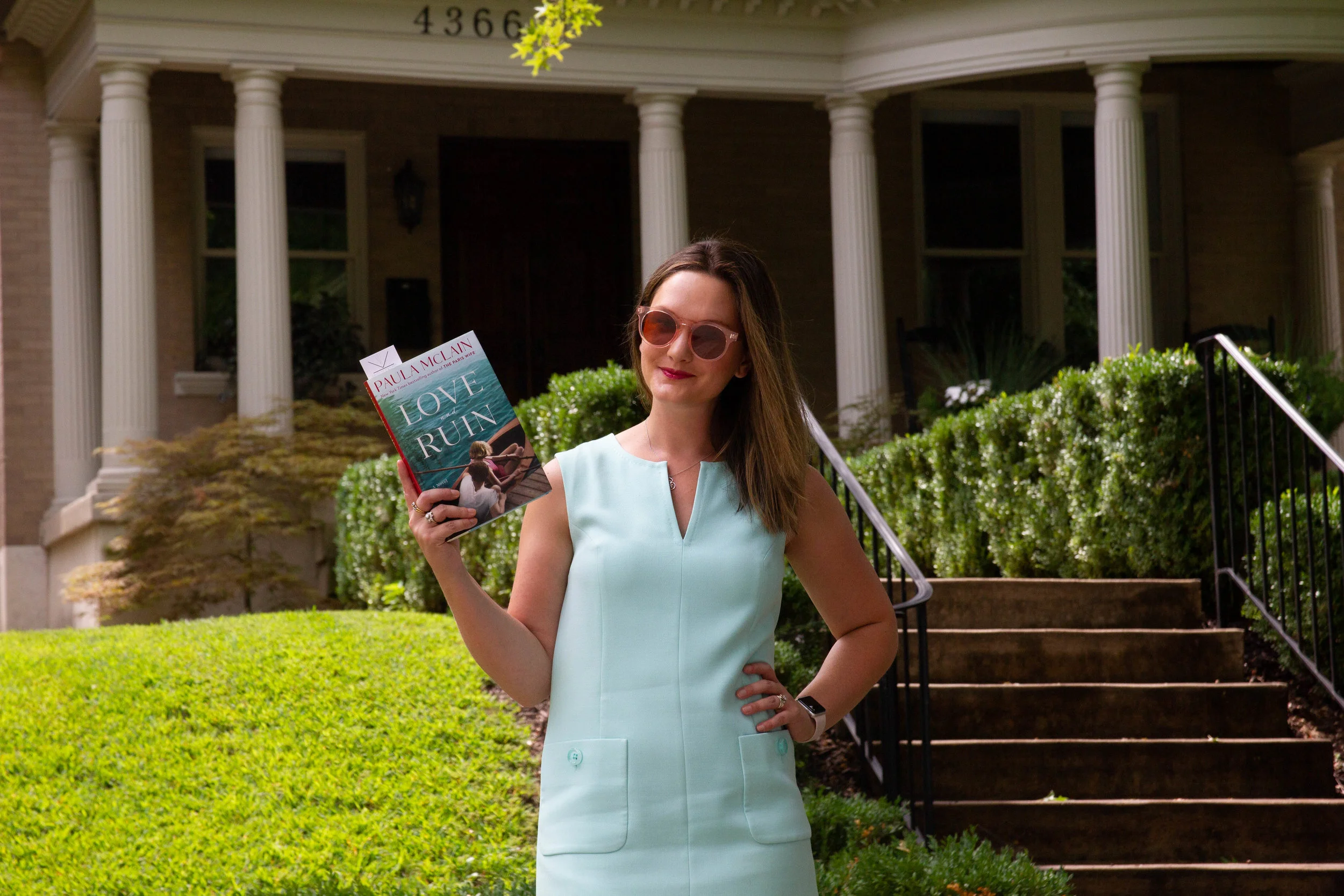 Reading Love and Ruin by Paula McLain outside Martha Gellhorn's childhood home in St. Louis