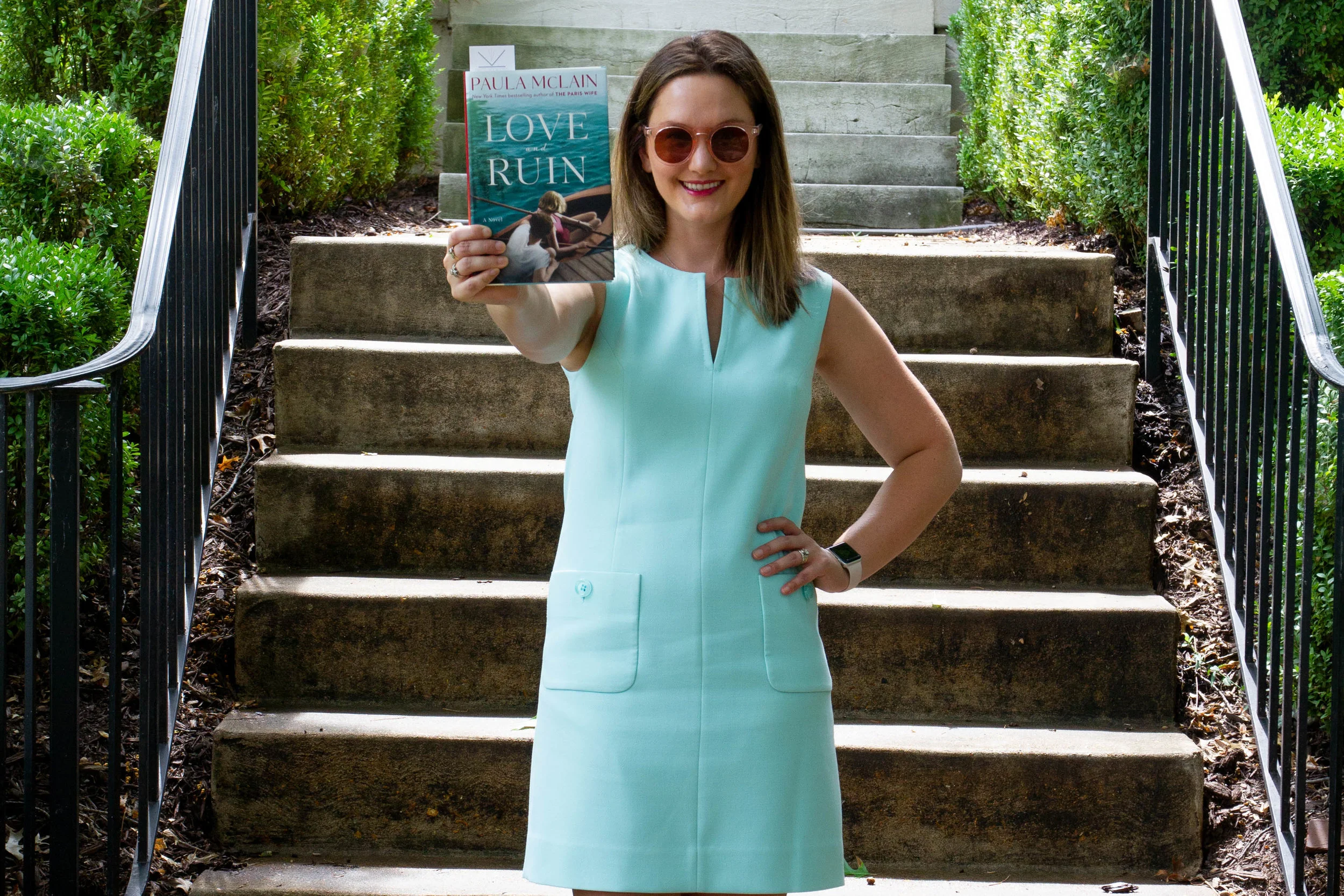 Reading Love and Ruin by Paula McLain outside Martha Gellhorn's childhood home in St. Louis