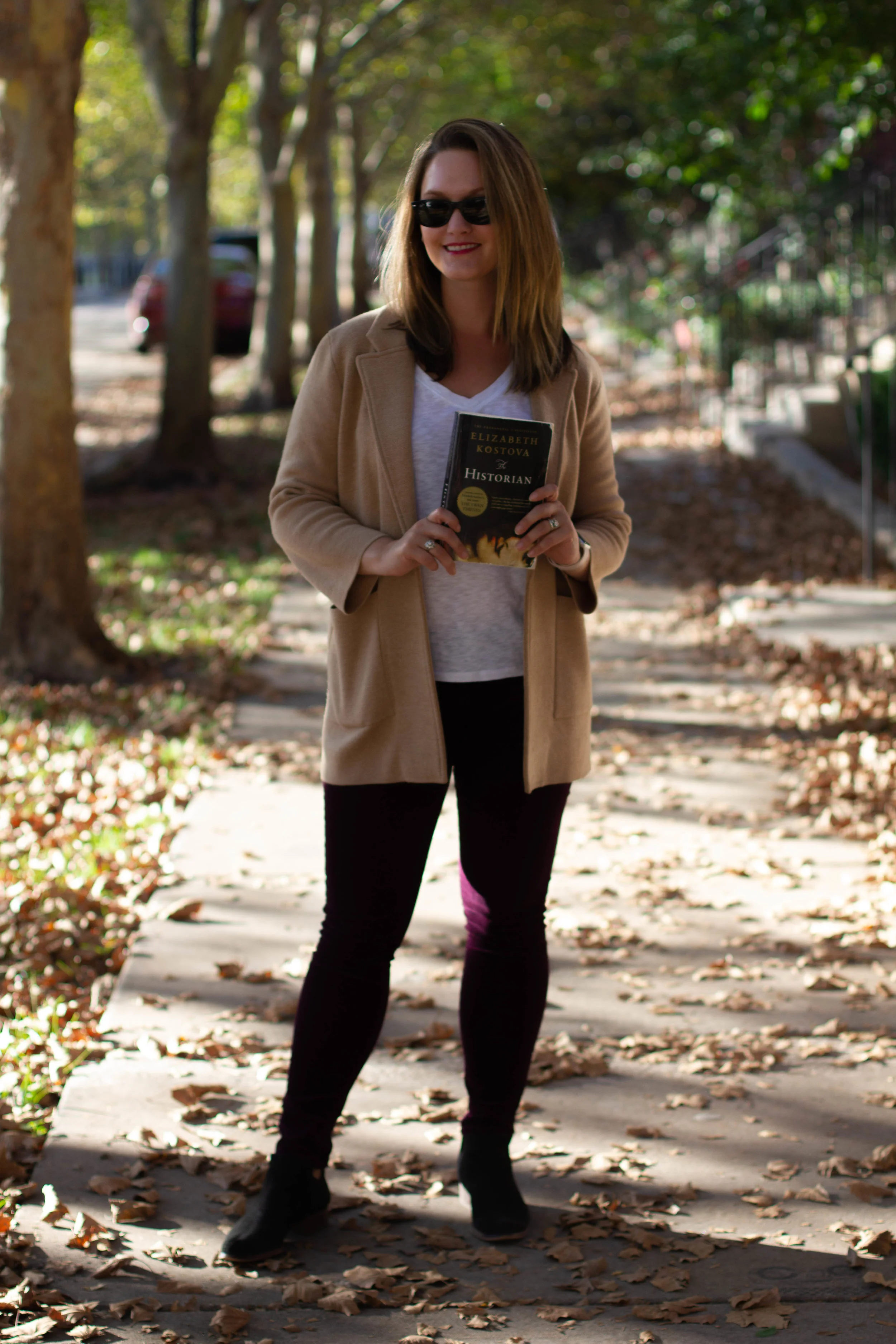 Reading The Historian by Elizabeth Kostova on the streets of New Town in St. Charles, MO