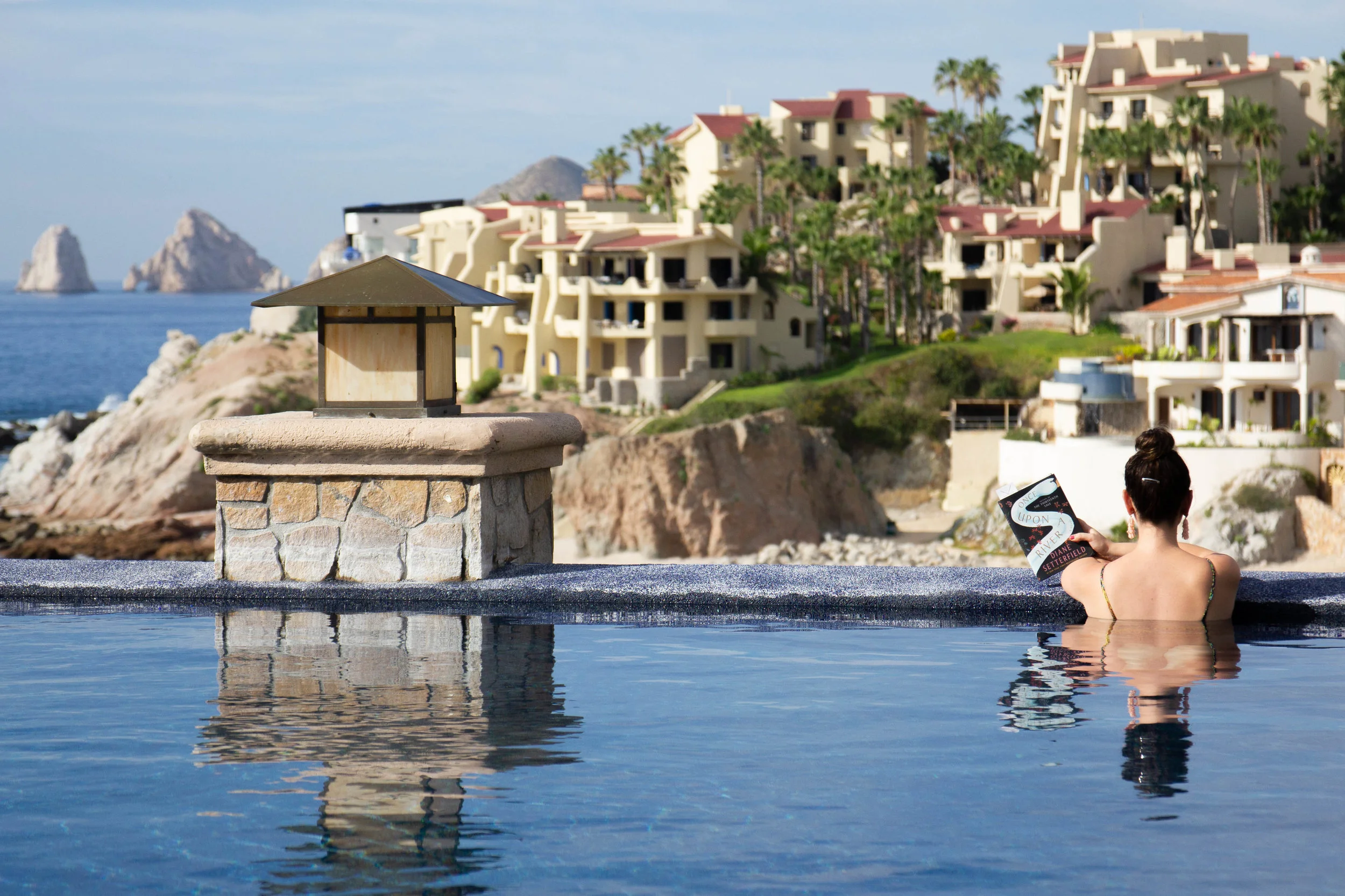 Reading Once Upon a River by Diane Setterfield at Sirena del Mar in Cabo, Mexico