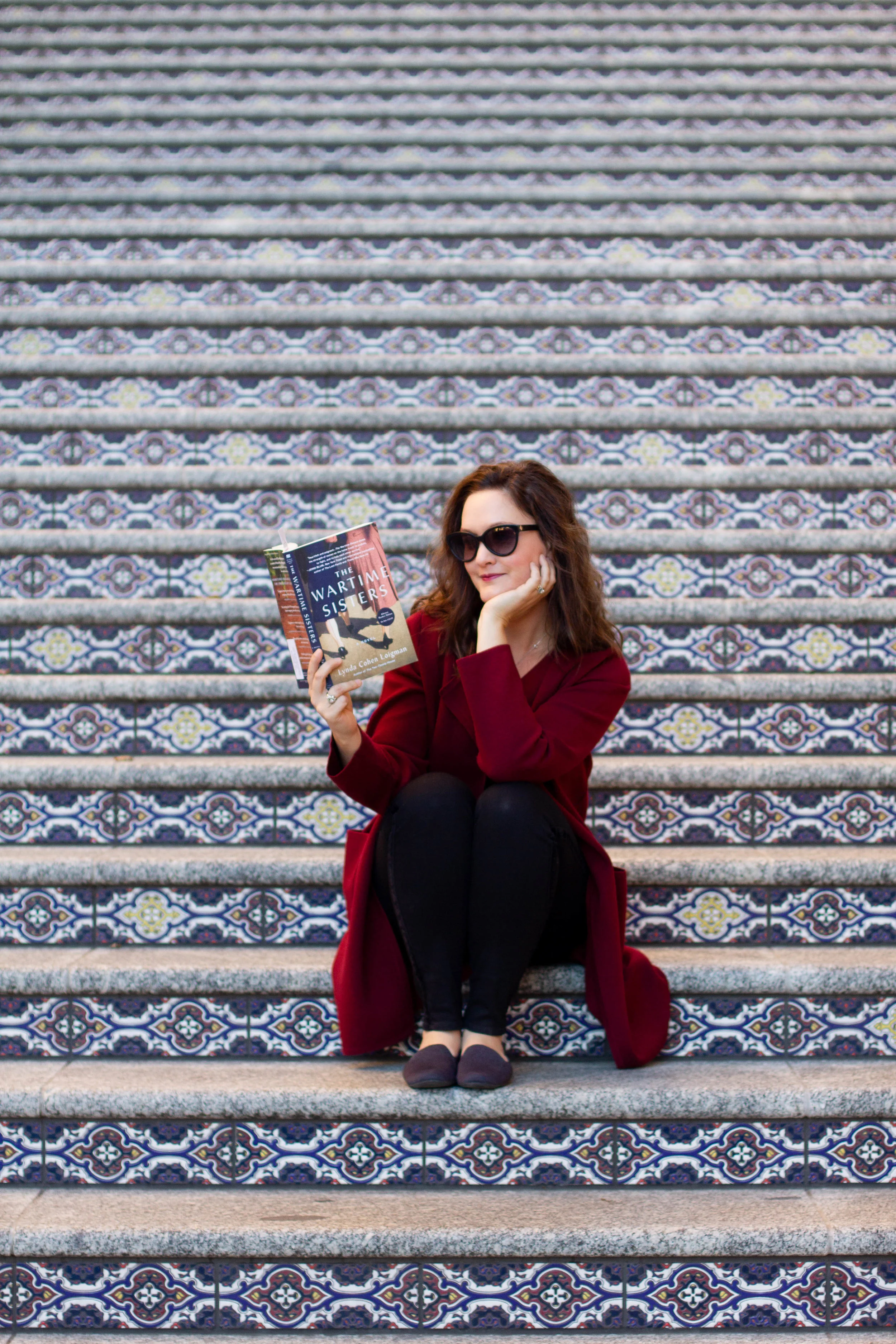 Reading The Wartime Sisters by Lynda Cohen Loigman at the Country Club Plaza in Kansas City, MO