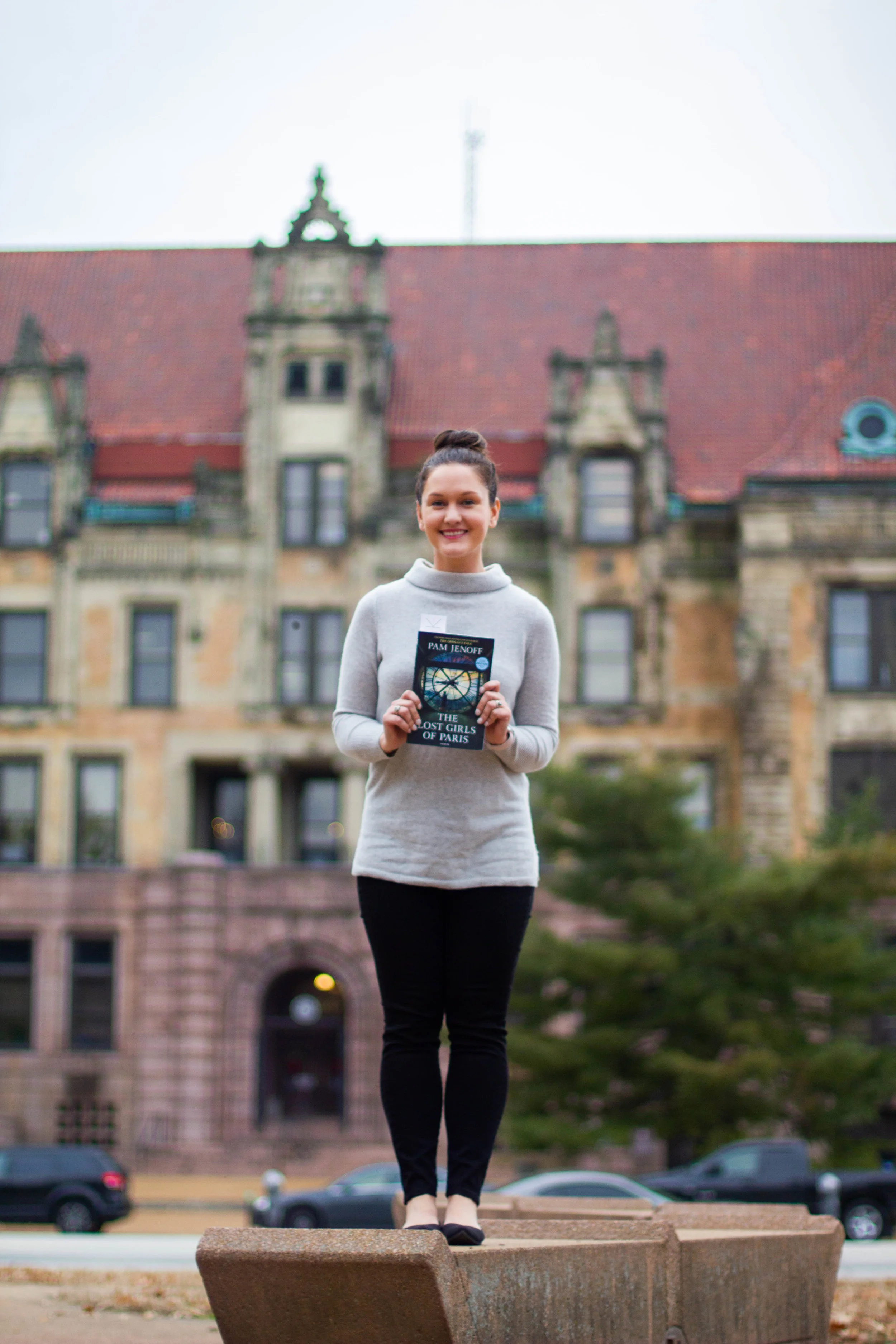 Reading The Lost Girls of Paris by Pam Jenoff at City Hall in St. Louis, MO