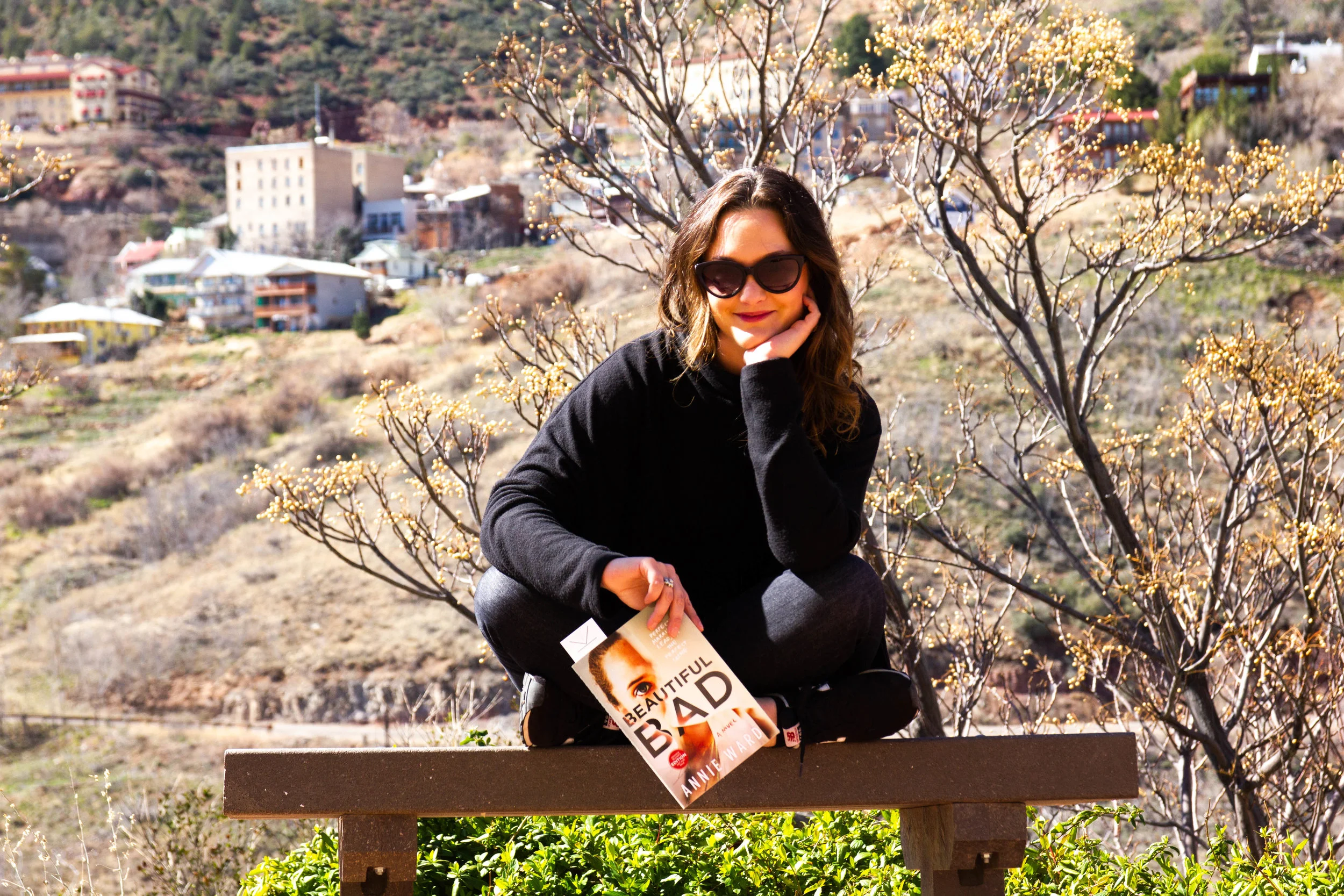 Reading Beautiful Bad by Annie Ward in Jerome, AZ