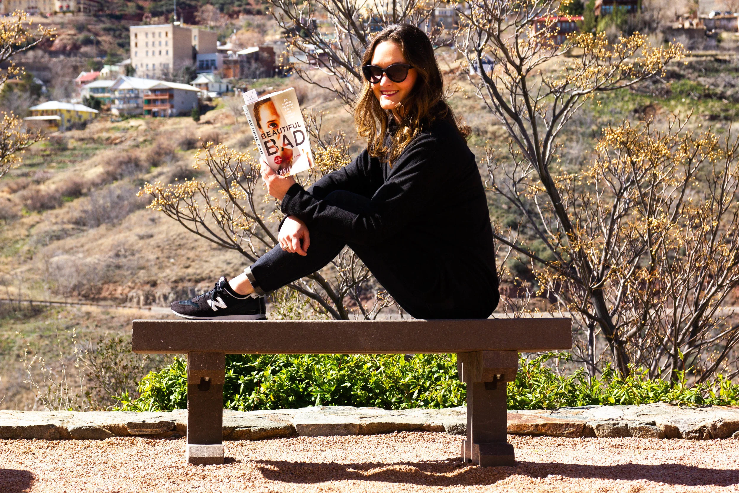 Reading Beautiful Bad by Annie Ward in Jerome, AZ