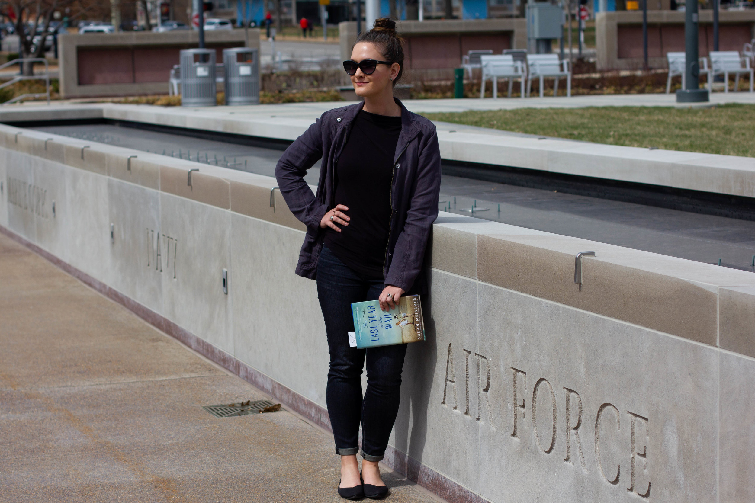 Reading The Last Year of the War by Susan Meissner at the Court of Honor, a monument in honor of WWII victims in St. Louis, MO