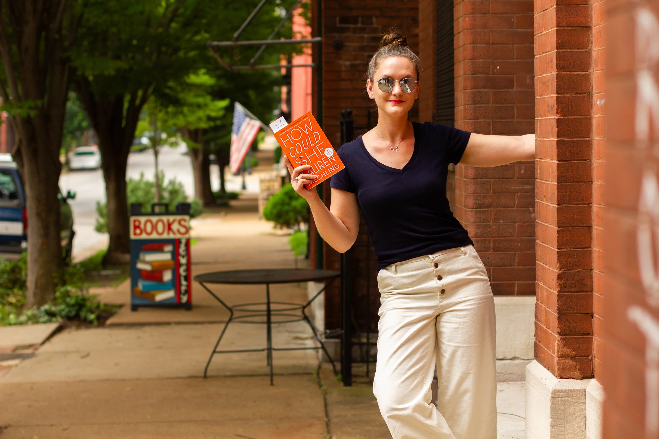 Reading How Could She by Lauren Mechling on Cherokee Street in St. Louis, MO